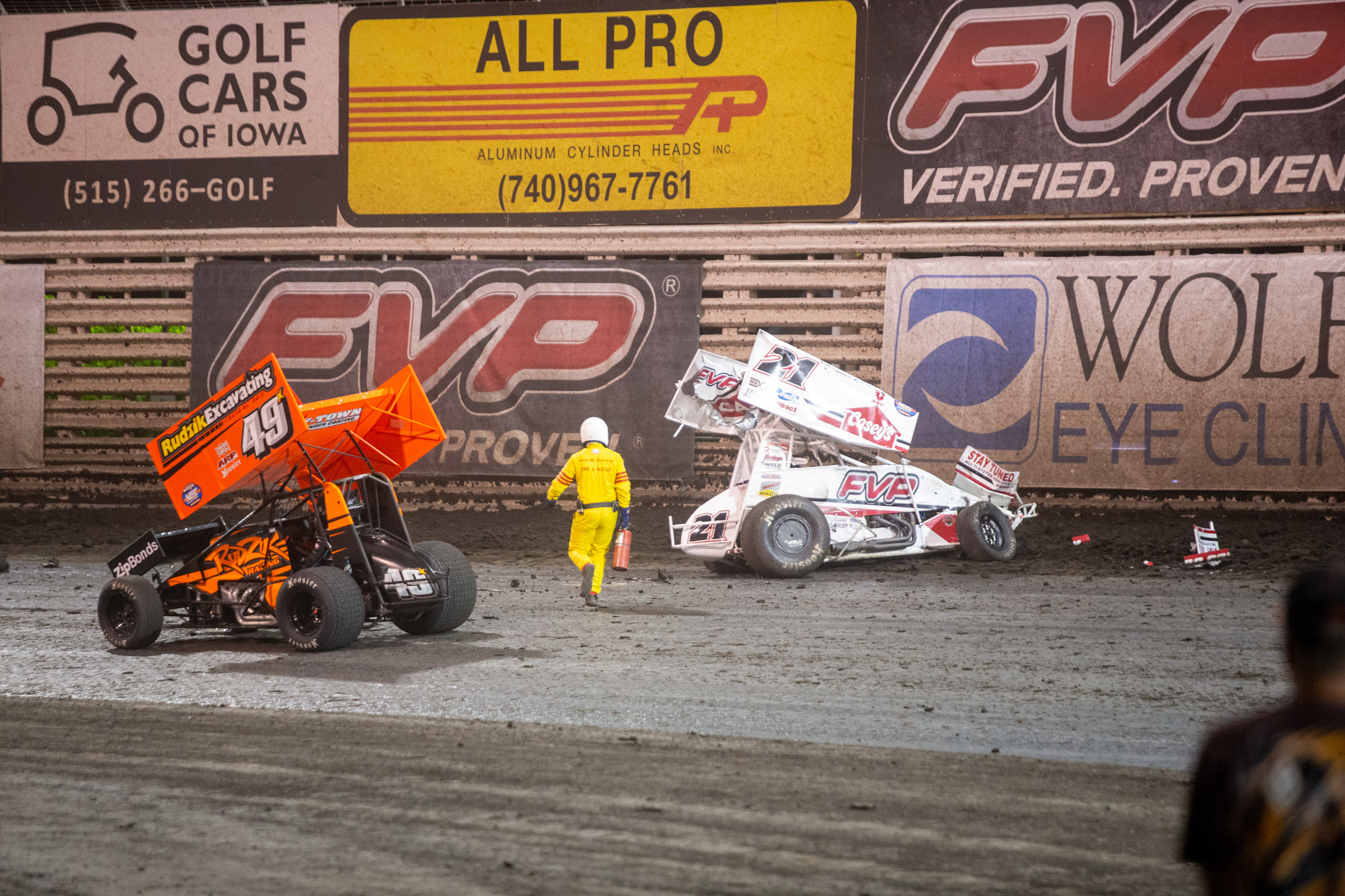 Crews rush to Brian Brown (21), of Grain Valley, Missouri, after a crash during the 60th Annual NOS Energy Drink Knoxville Nationals presented by Caseys Championship Night at Knoxville Raceway in Knoxville, Iowa on Saturday, Aug. 14, 2021.