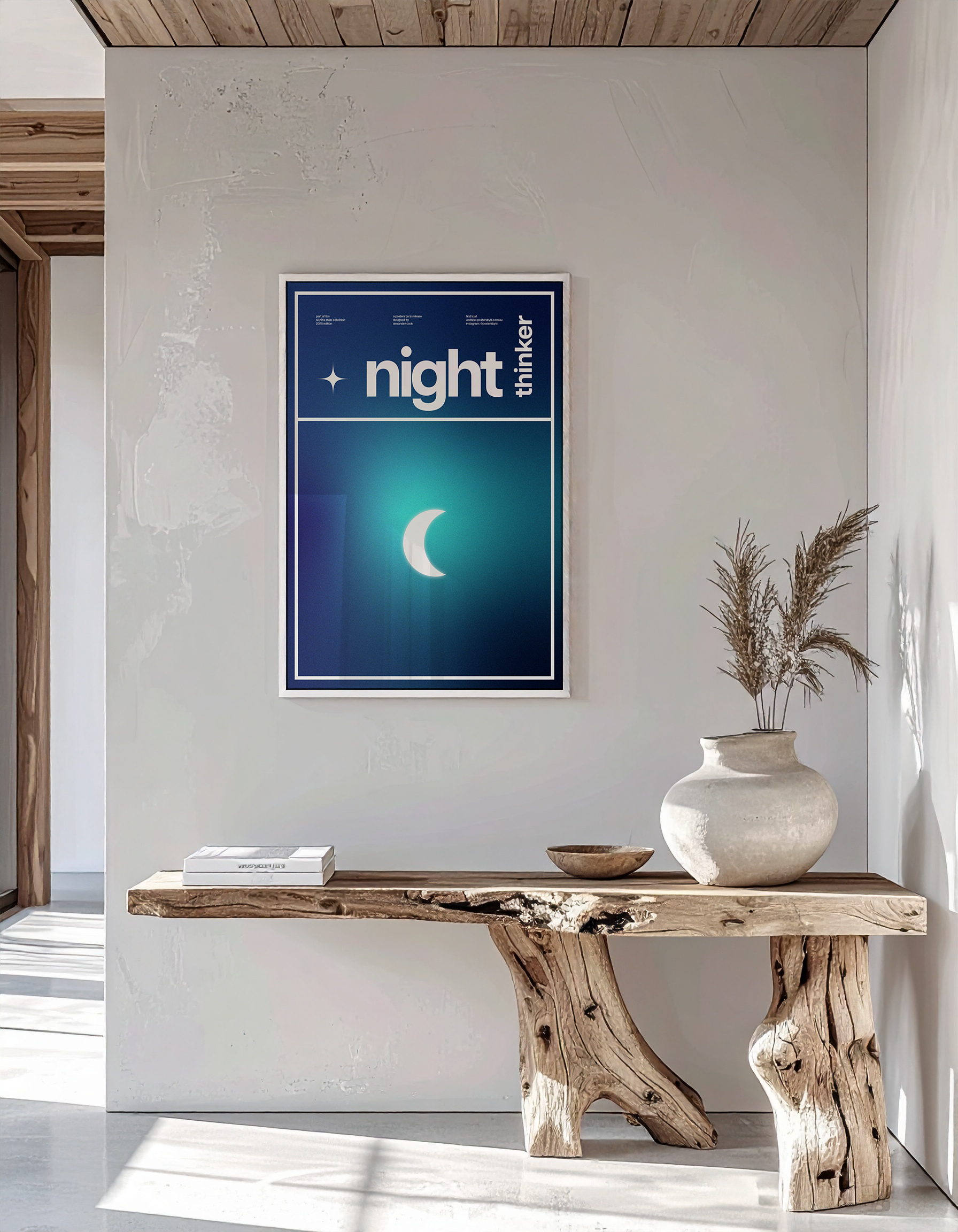 High-end interior mock-up of the 'Night Thinker' print in a white frame on a textured wall and wooden bench.