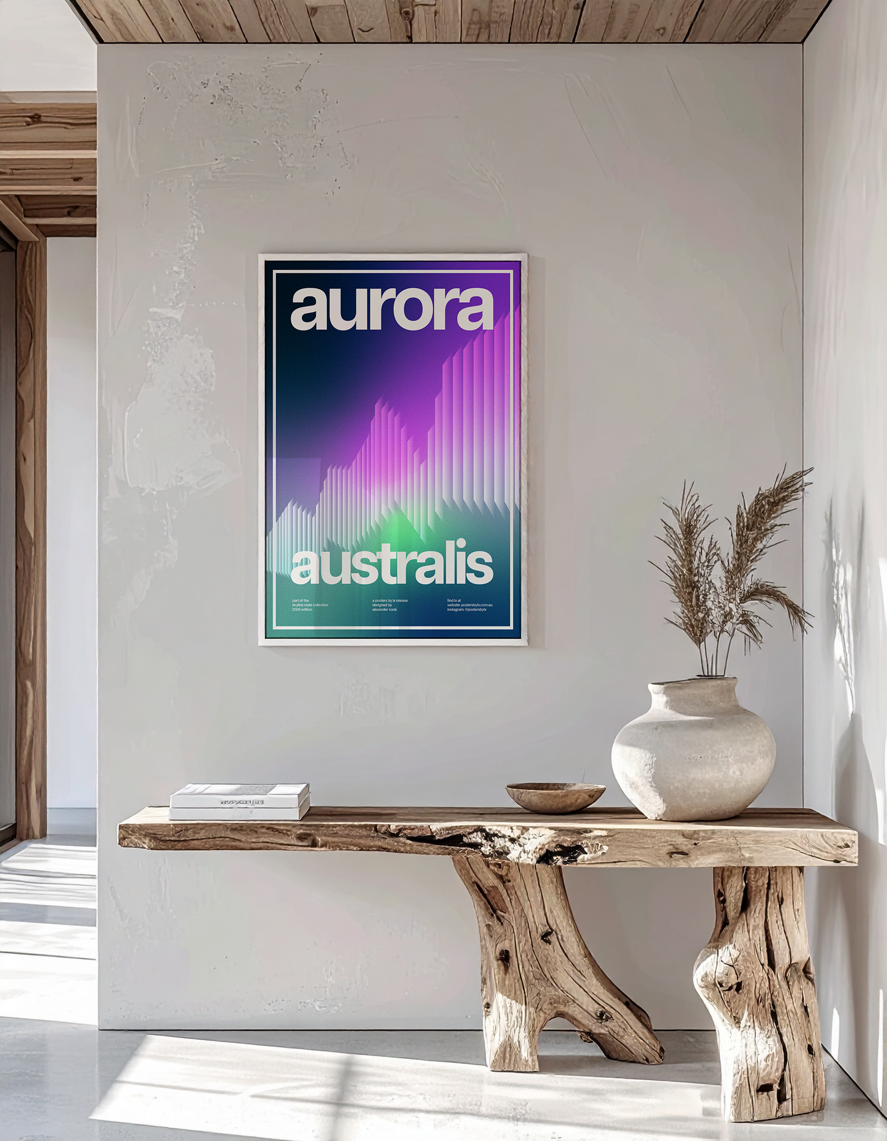 High-end interior mock-up of the 'Aurora Australis' print in a white frame on a textured wall and wooden bench.