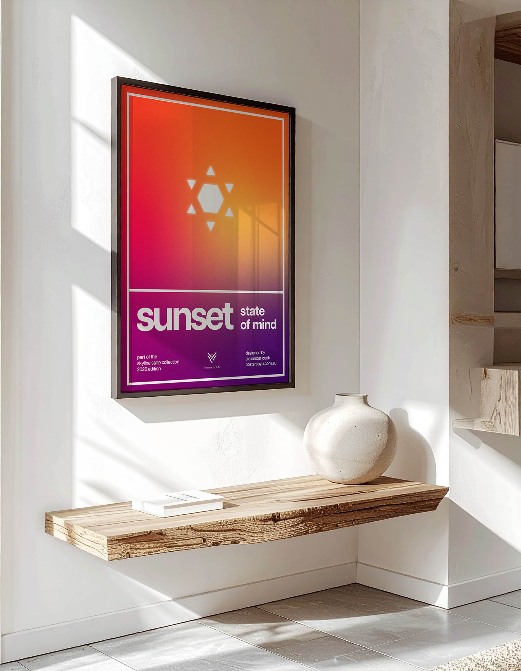 Luxury interior mock-up of the 'Sunset State of Mind' poster in a black frame, hanging above a rustic wooden floating shelf.