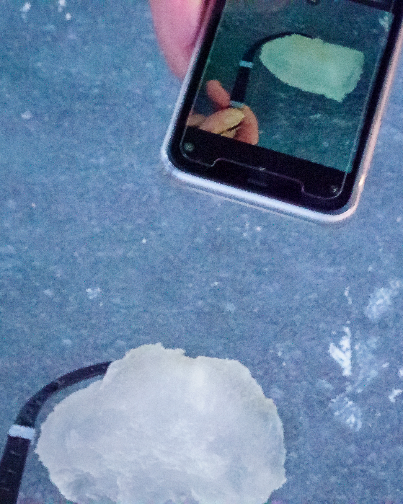 Checking the ice. The quality of the ice is so bad that it shouldn't be able to last the weight of us. We were lucky it didn't break.