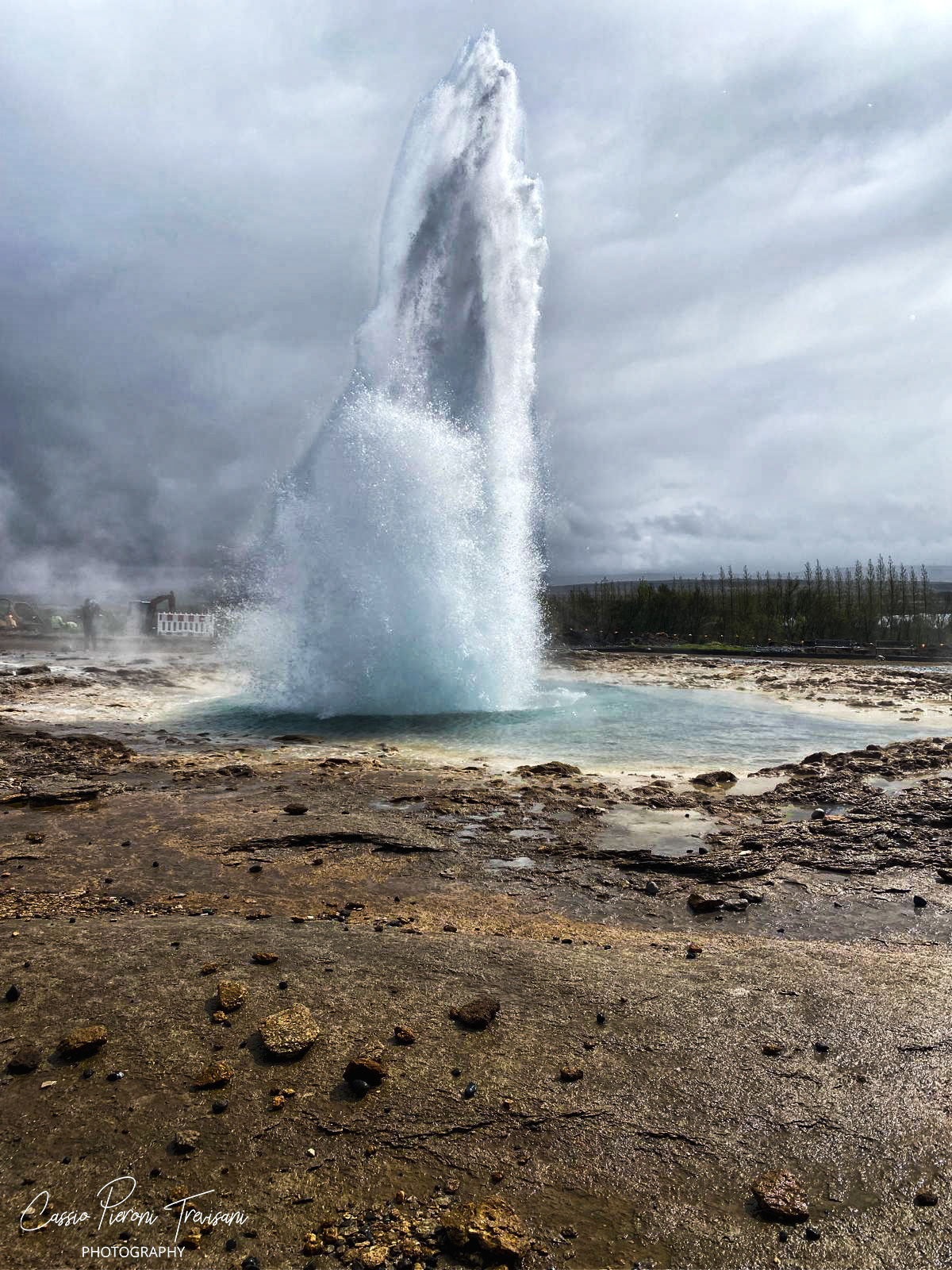 Strokkur bursts upward in a column of boiling water, one of the Golden Circle’s most dramatic displays of geothermal power.