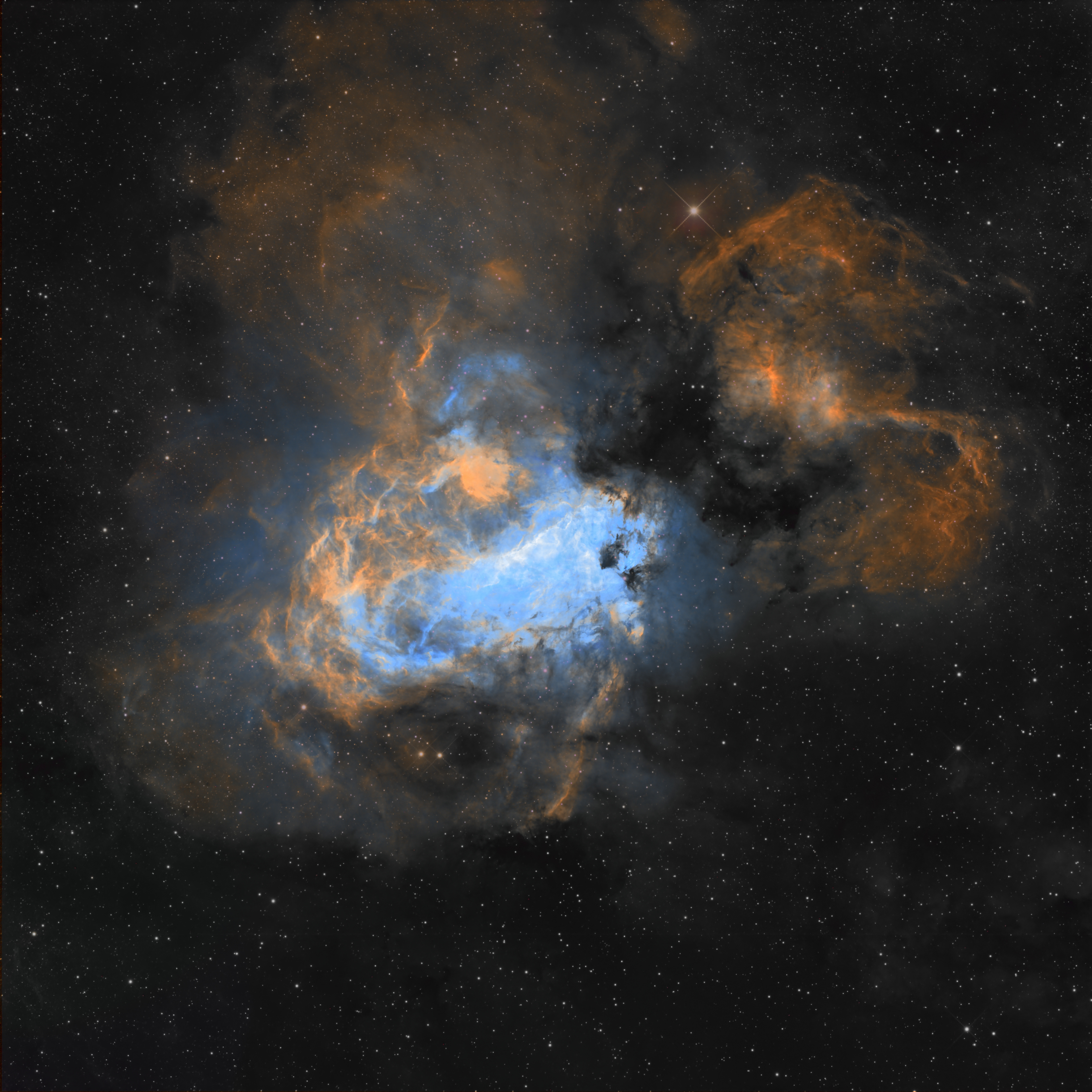 M17 — the Omega Nebula, a glowing stellar nursery in Sagittarius, filled with bright ionized gas, sweeping dust lanes, and delicate structures shaped by young massive stars.
