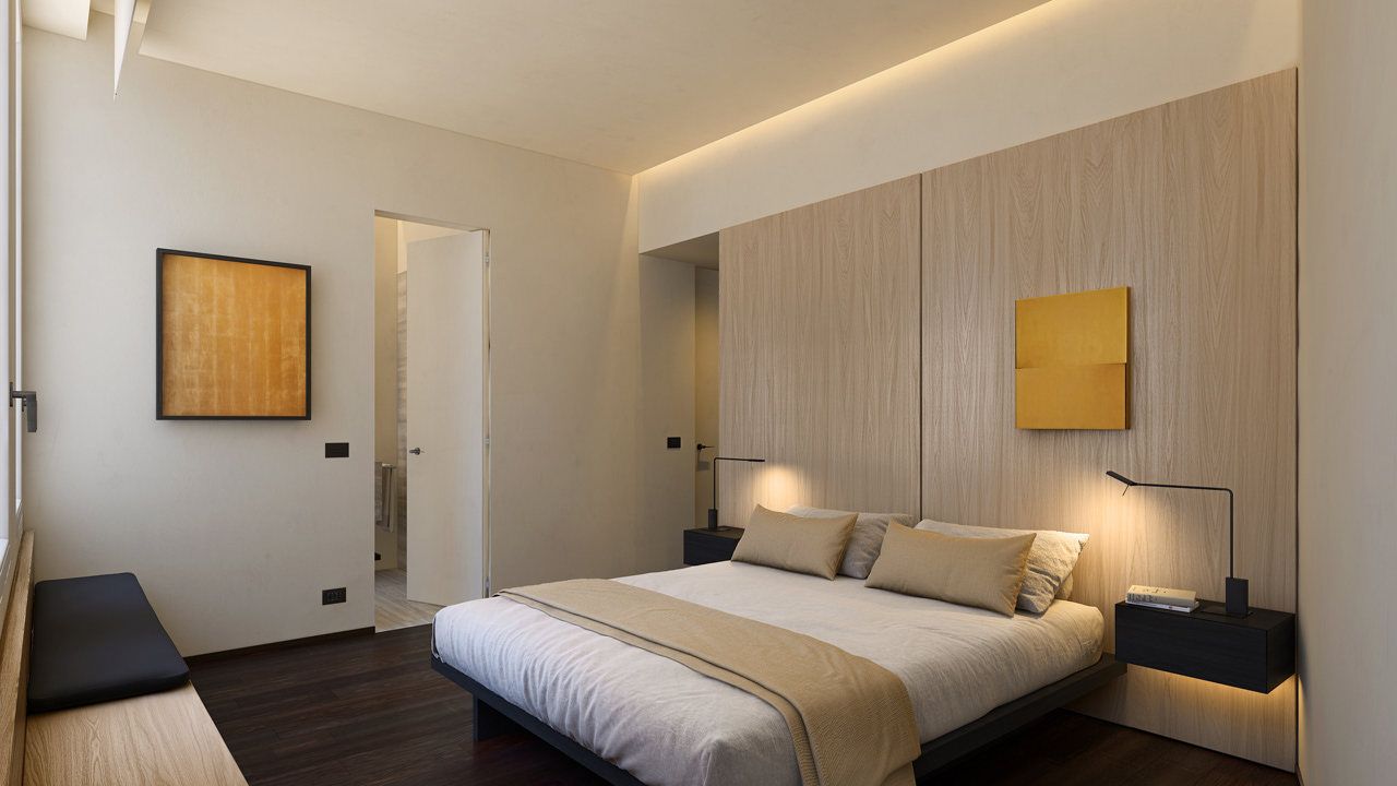 Bedroom with warm light oak headboard, wengè parquet floor, dark wood finishes and en suite silver travertine bathroom – Yume Visual