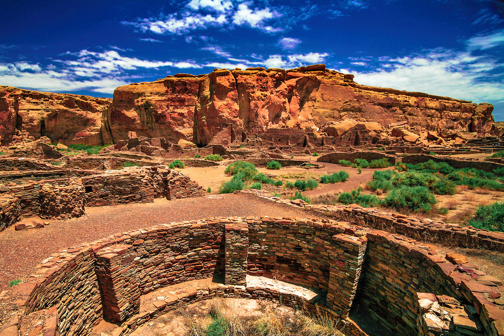 Standing in the west-side room block – facing north-east, across the western plaza – this view of Pueblo Bonito in New Mexico, highlights one of the more unique elements of Chacoan architecture. Much smaller than the great kivas found throughout the park, several kivas like this one are found housed within the square rooms of Chaco Canyon’s great houses.