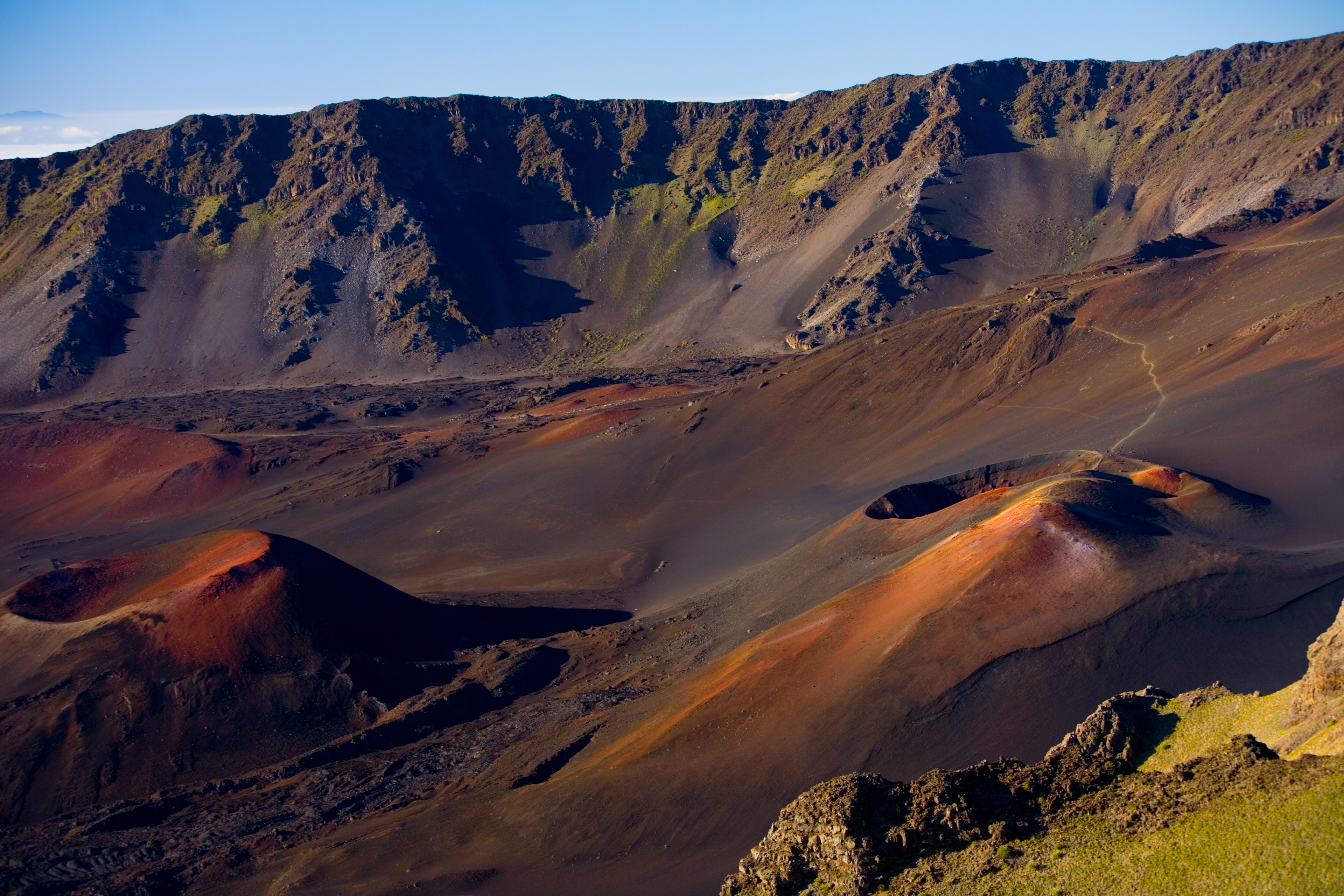 This view of Ka Lu'u o ka O'o Cinder Cone in Haleakala Crater could easily have been mistaken for a lunar landscape - or the land of Mordor - if not for the presence of green on the far rim. Volcanic landscapes must be some of the most fractured, harsh, and majestic environments in nature.