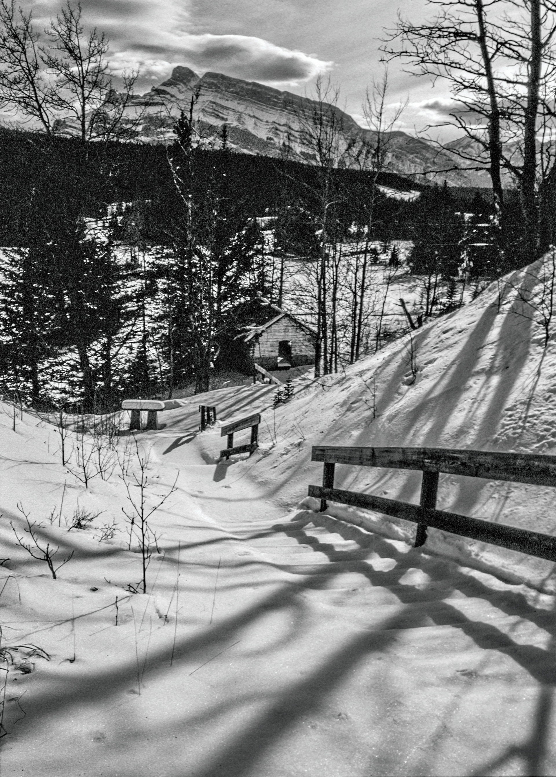 I had decided a few years ago that I wanted to shoot the mountain ghosttown of Bankhead - near Banff, Alberta - in the snow, and when I finally got around to it they had had a doosey of a snow fall the night before! Turns out through the winter the road into the site is closed to traffic, and becomes a popular cross-country skiing trail. Needless to say, the walk from the parking area at Lake Minnewanka is all the longer through hip-deep snow.
