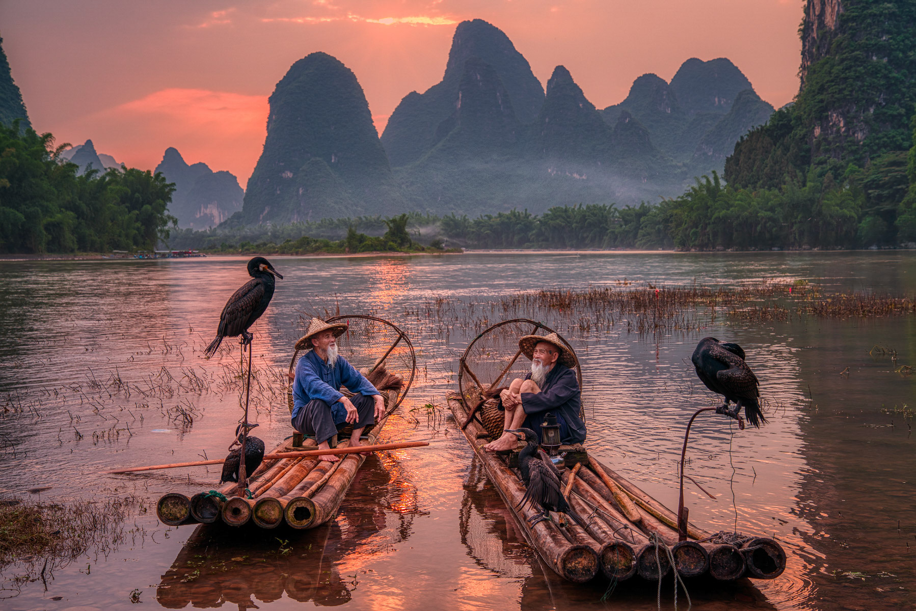 The Brothers In Discussion At Sunset On The Li River