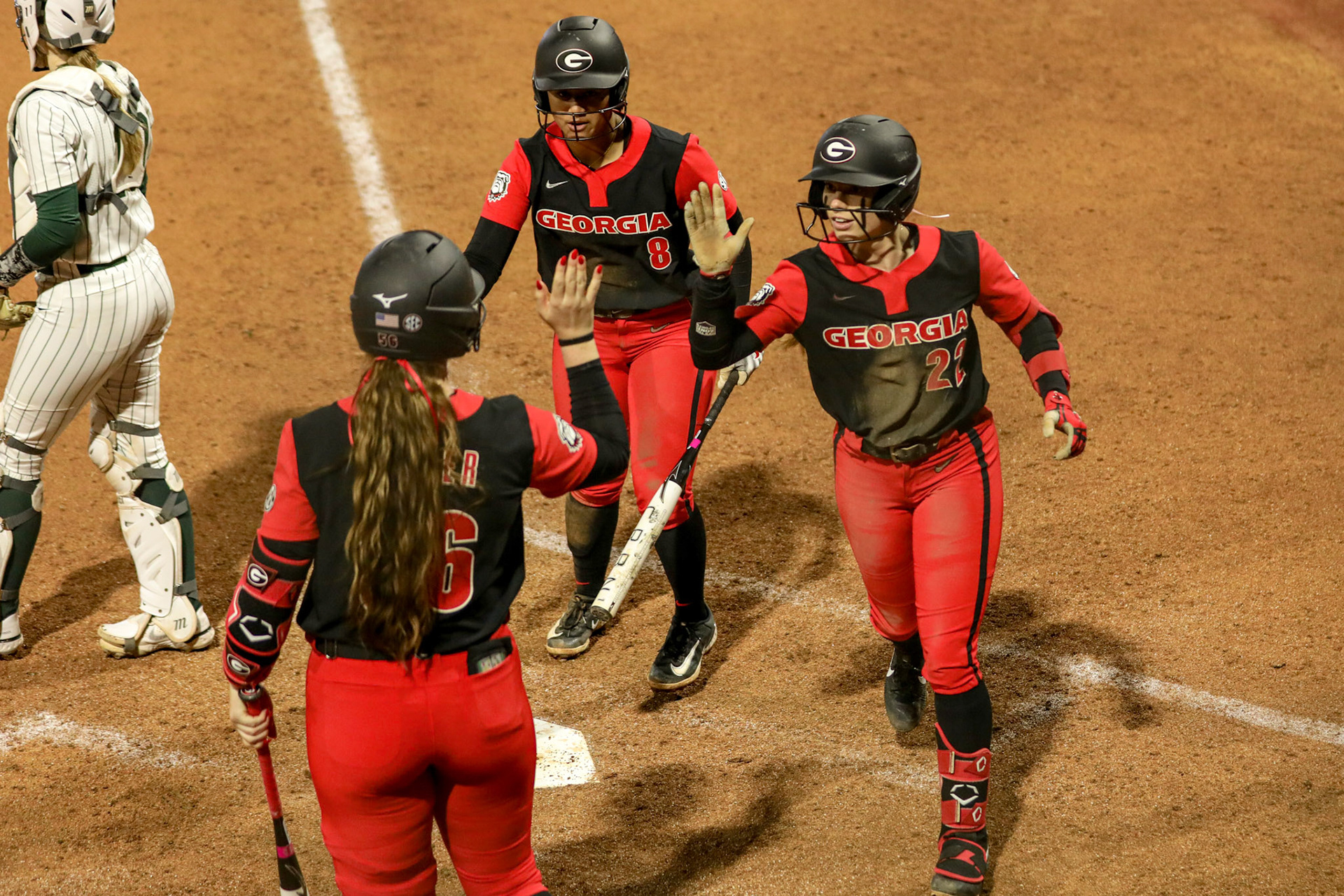 Georgia catcher Marisa Miller (56), Georgia catcher Mua Williams (8), Georgia infielder Emily Digby (22) during Georgia’s game against Michigan State in the 2025 Red &amp; Black Showcase presented by T-Mobile at Jack Turner Stadium in Athens, Ga., on Friday, Feb. 14, 2025. (Blake Caviness/UGAAA)
