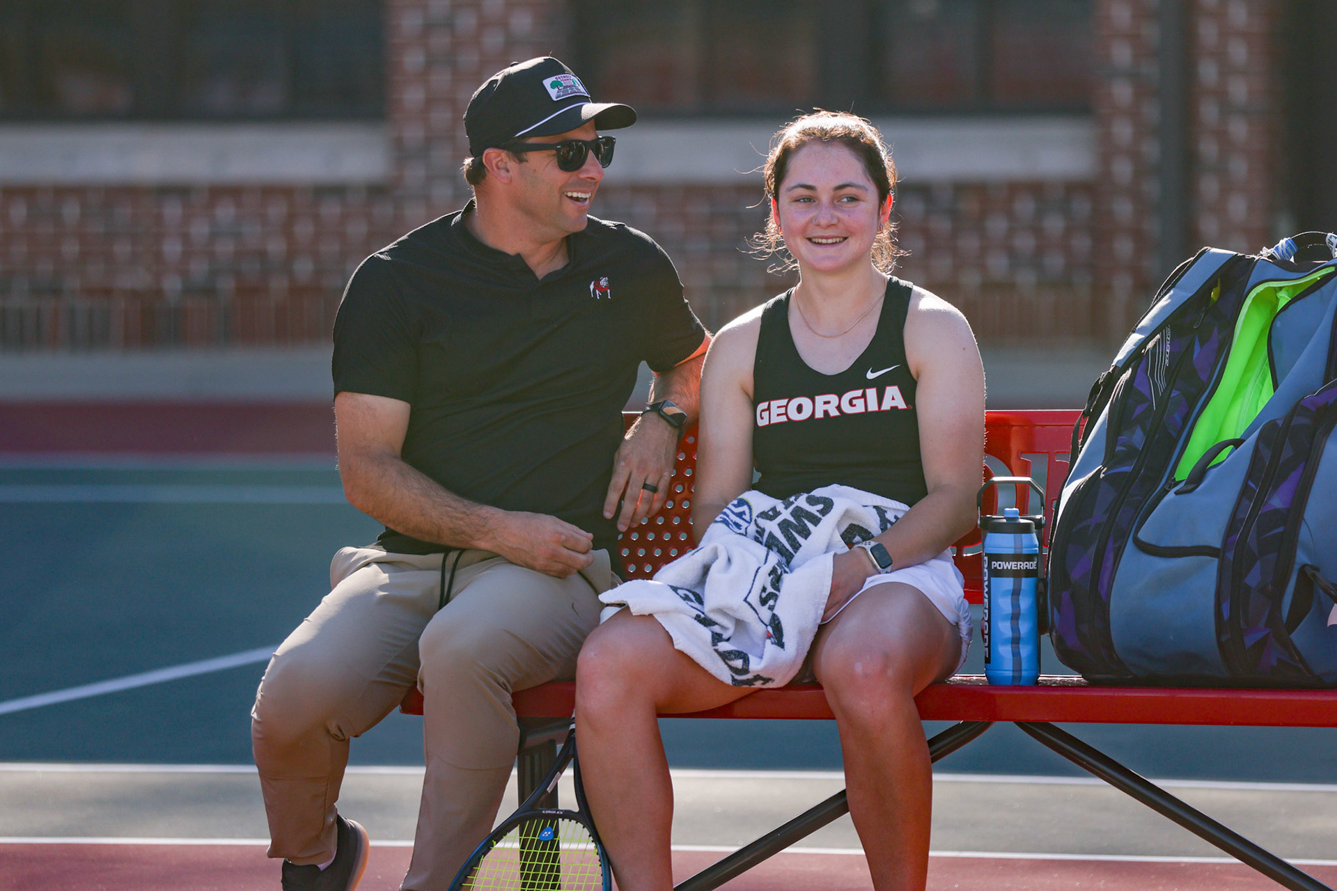 Georgia head coach Drake Bernstein, Georgia tennis player Anastasiia Lopata during Georgia’s match against Arkansas at Henry Feild Stadium inside the Dan Magill Tennis Complex in Athens, Ga., on Friday, March 21, 2025. (Blake Caviness/UGAAA)