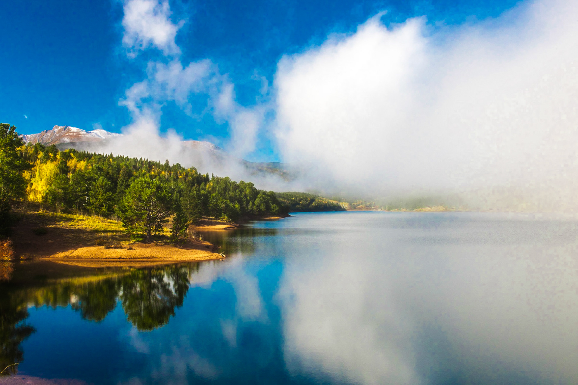 Colorado Springs, CO: Fog rolls in over crystal reservoir near Pikes Peak.