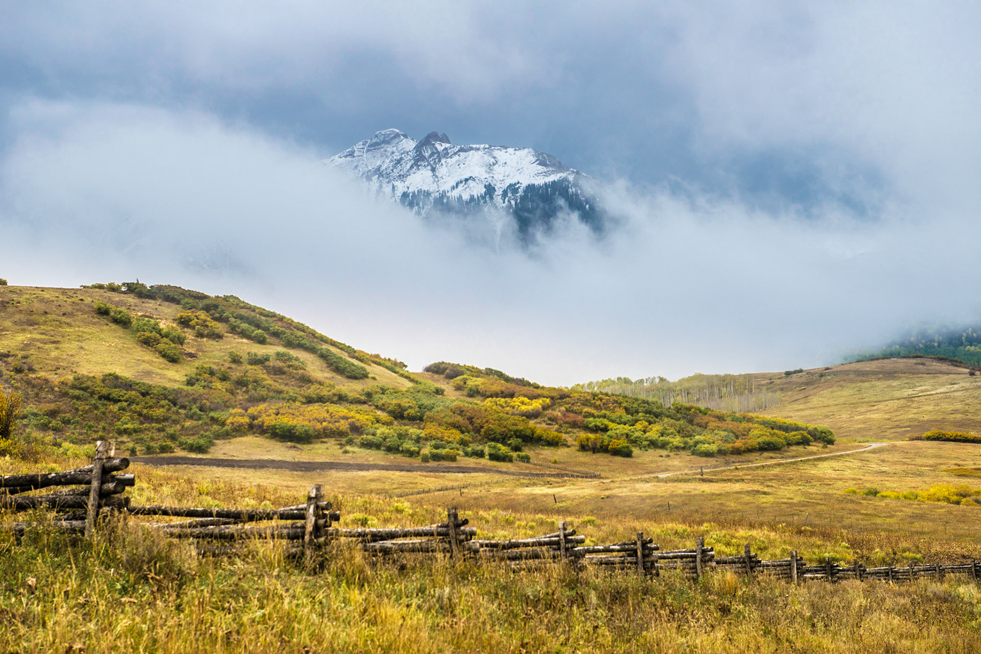 Telluride, CO: One of the mountains nears Dallas Peak through the fog on a cloudy fall morning