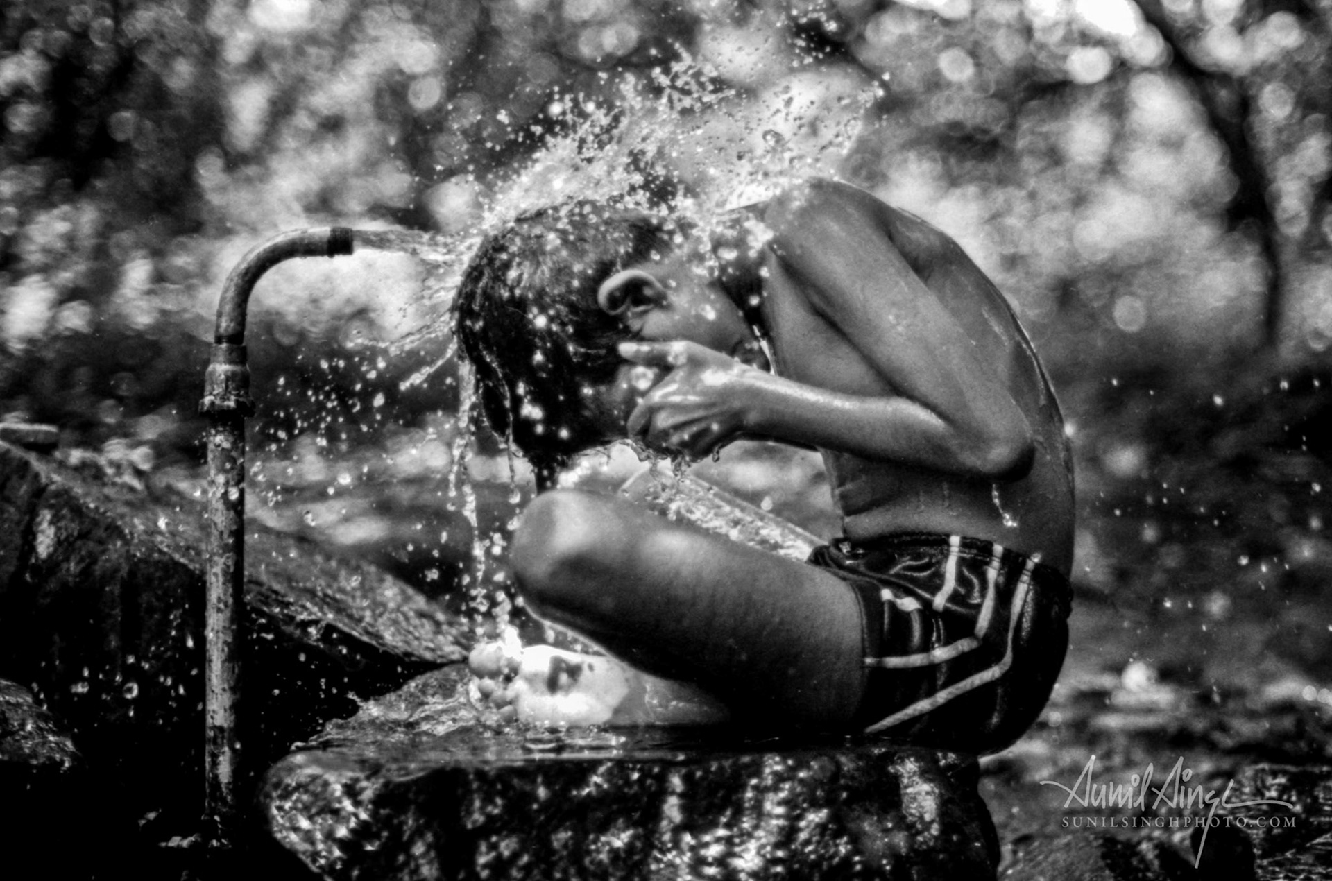Bathing boy, Mumbai, India