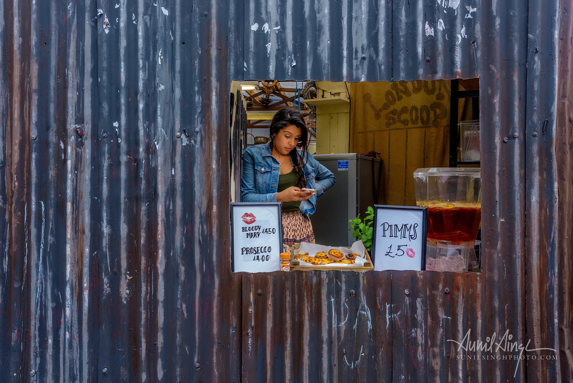 A hole-in-wall bar at Columbia flower market, London, UK