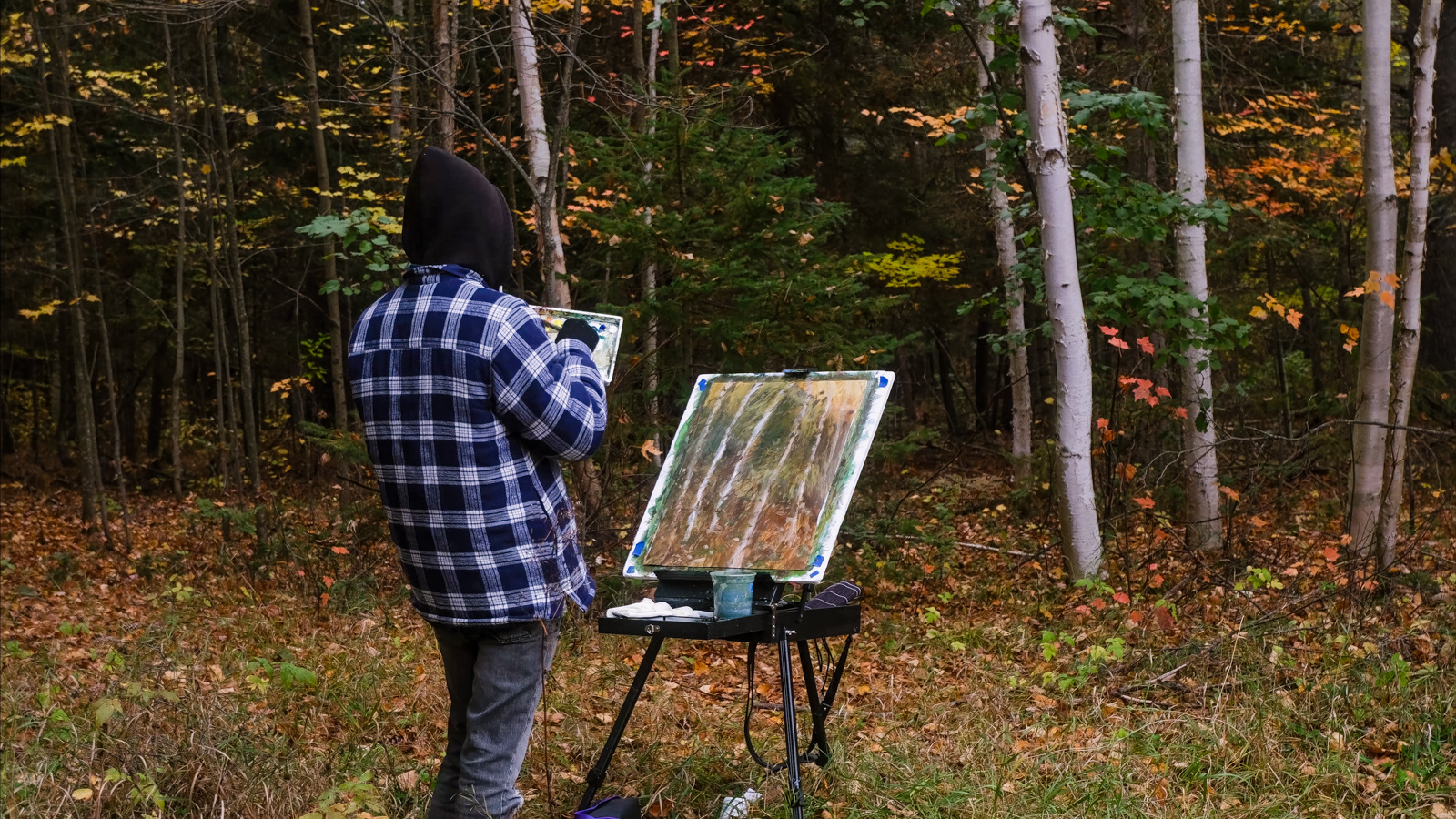 Curt painting one of his 'Forest ii' paintings in Foy Provincial Park Ontario 2023
