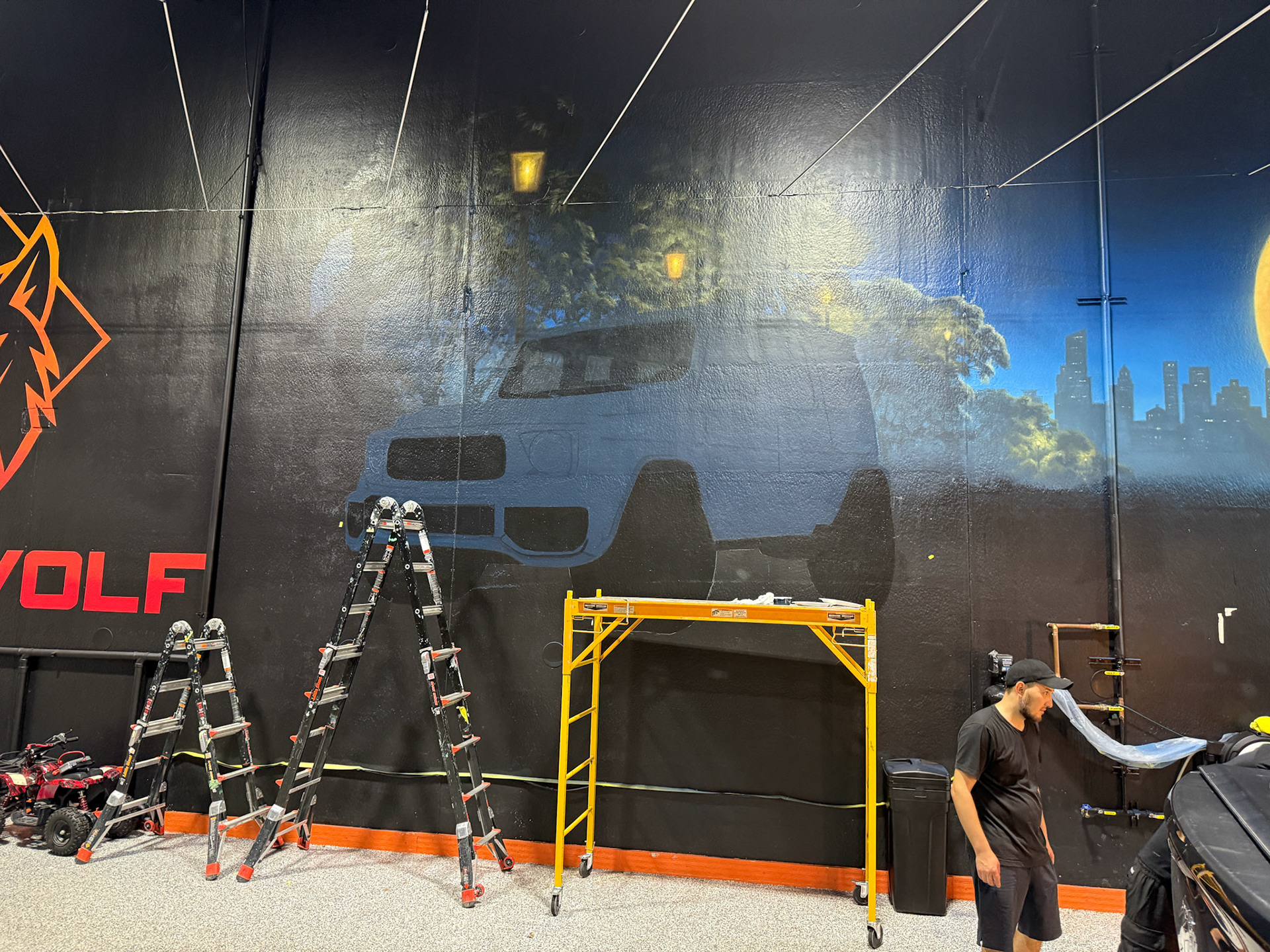 Dent Wolf Car Detailing Mural – Hand-Painted Chicago Skyline and Luxury Cars in Joliet, Illinois