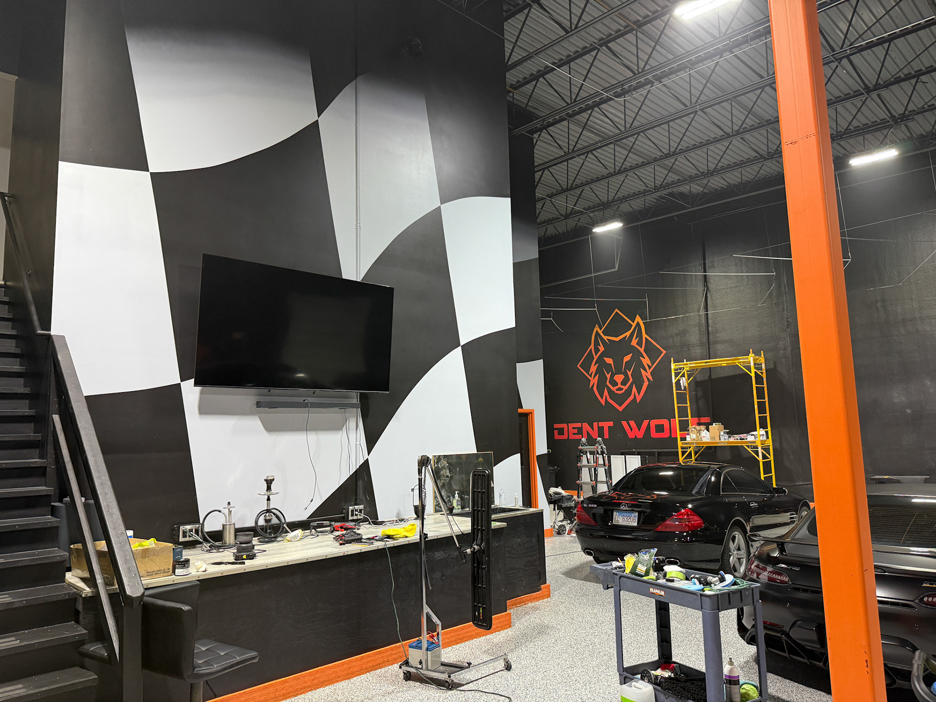 Dent Wolf Car Detailing Mural – Hand-Painted Chicago Skyline and Luxury Cars in Joliet, Illinois