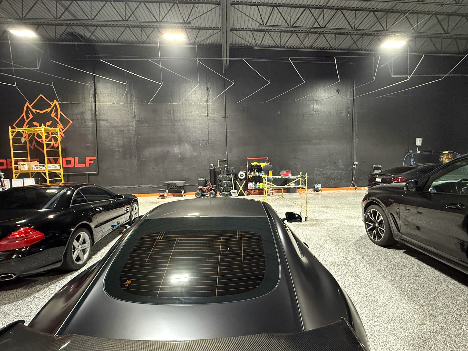 Dent Wolf Car Detailing Mural – Hand-Painted Chicago Skyline and Luxury Cars in Joliet, Illinois