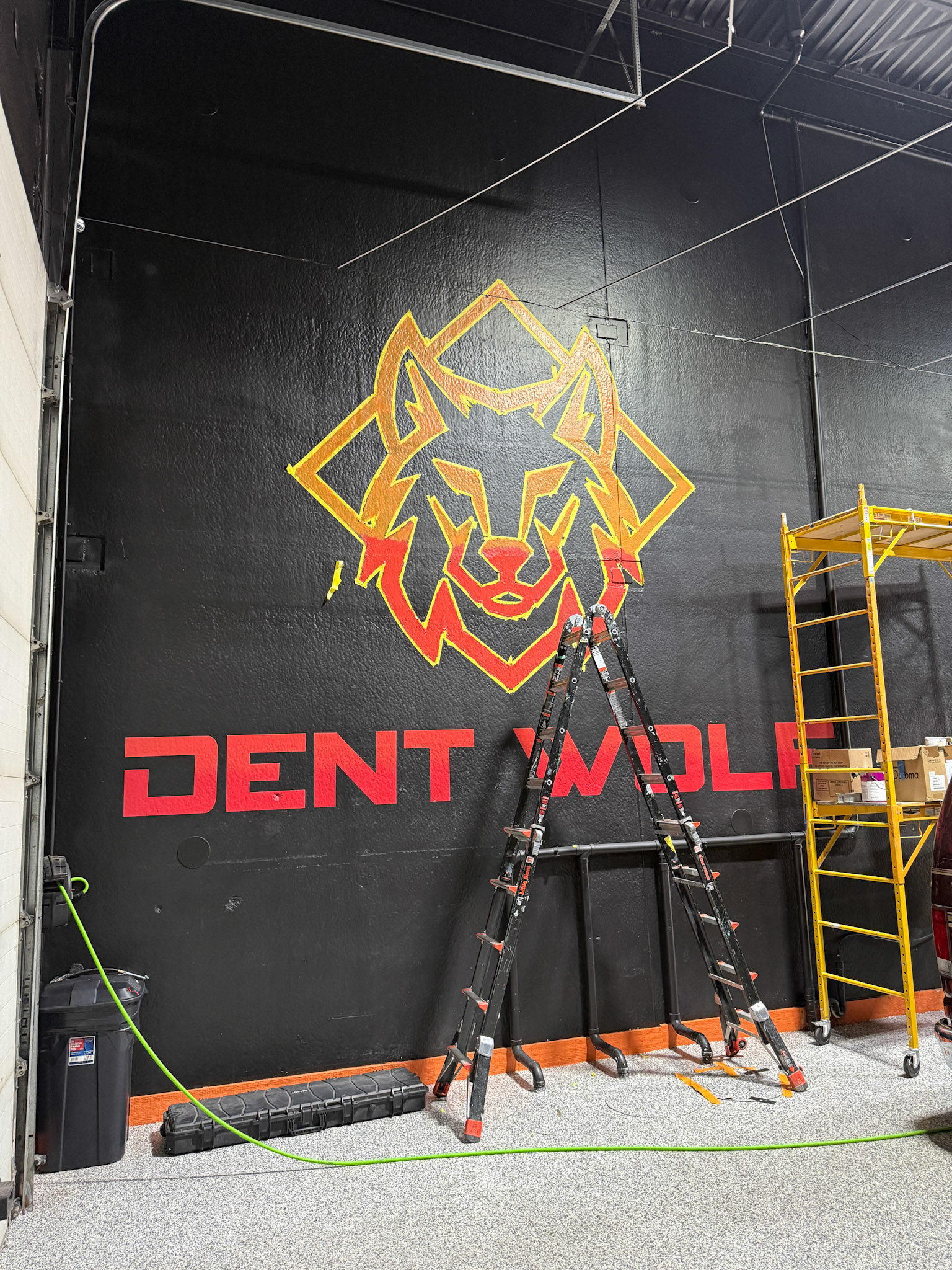 Dent Wolf Car Detailing Mural – Hand-Painted Chicago Skyline and Luxury Cars in Joliet, Illinois