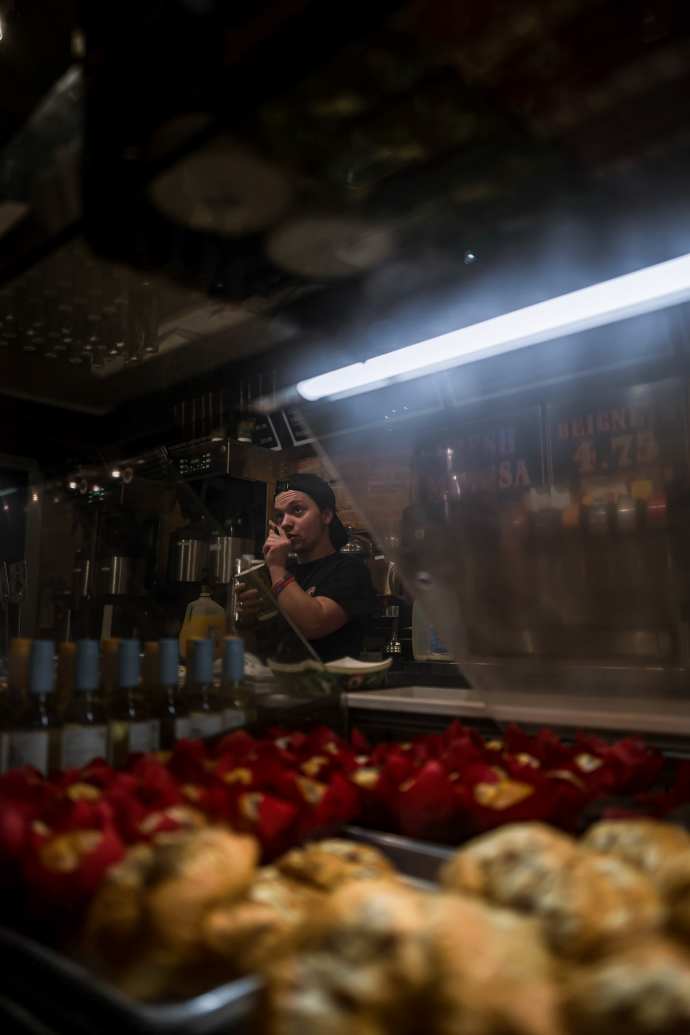 Barista taking an order of Beignets in New Orleans, Louisiana