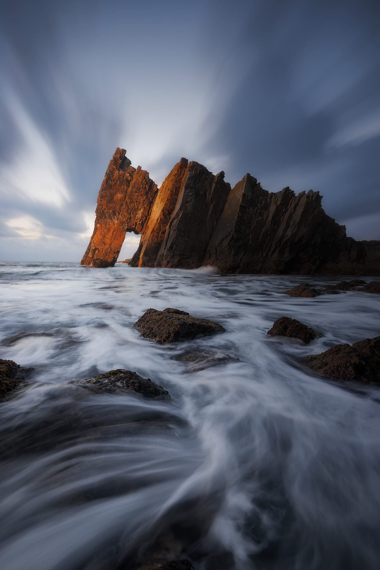 Warm sunset light hitting the spire of the cathedral at Cabo Busto, Asturias | Luz cálida del atardecer iluminando la aguja de la catedral en Cabo Busto, Asturias