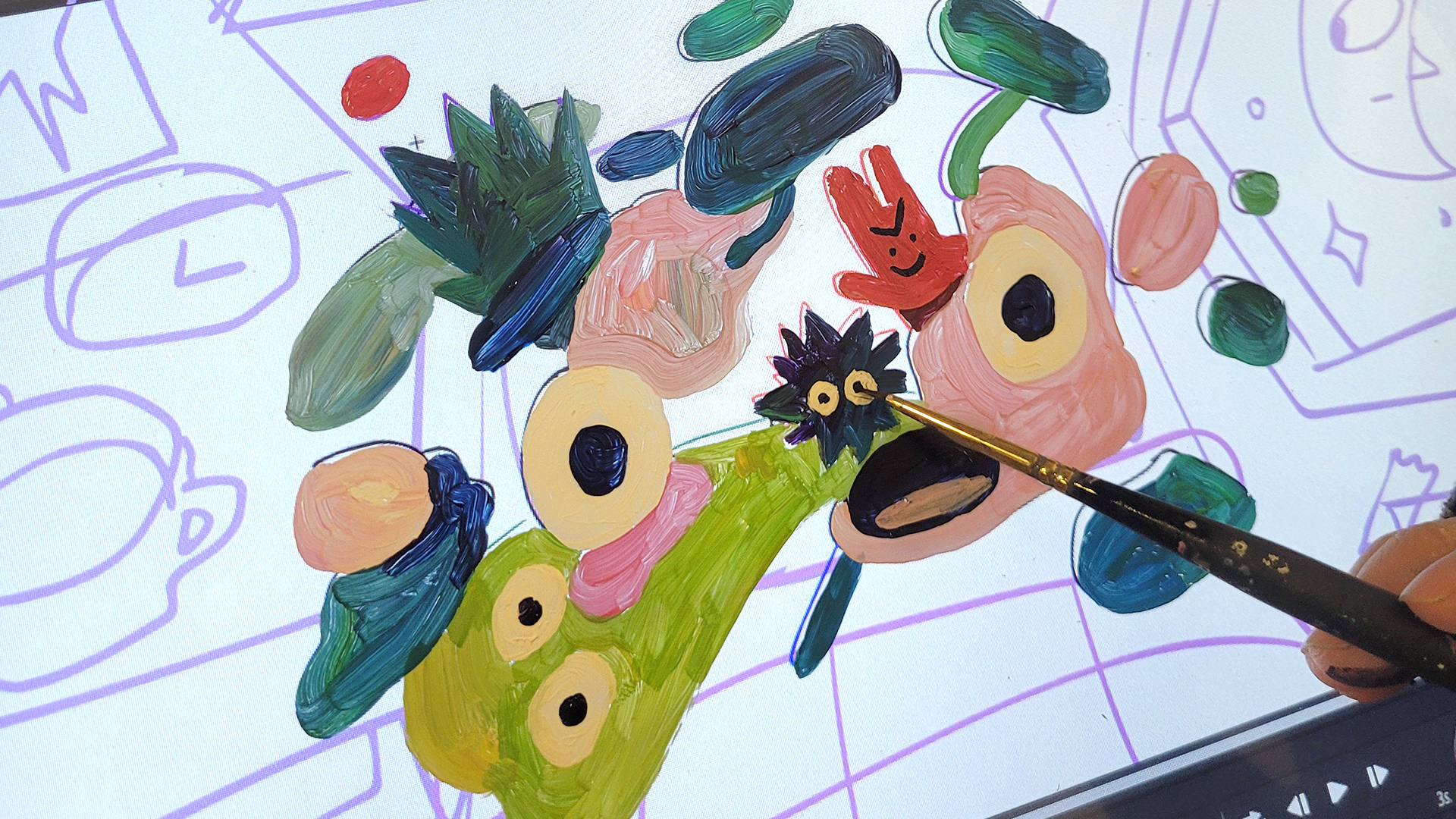 Process photo of painting on cels over digital drawing on the wacom