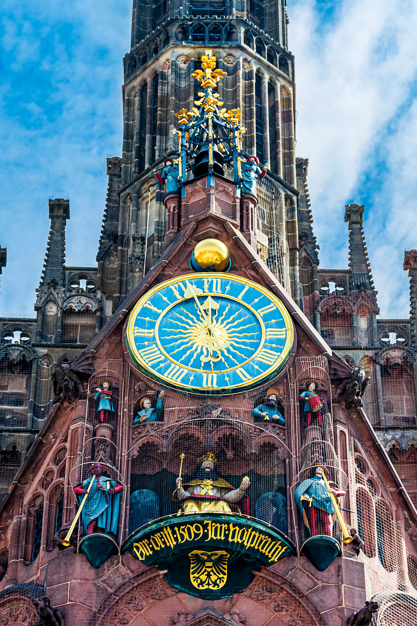 The Männleinlaufen - mechanical clock with procession of trumpeters, dummer, and electors aound Holy Roman Emperor. (1509)