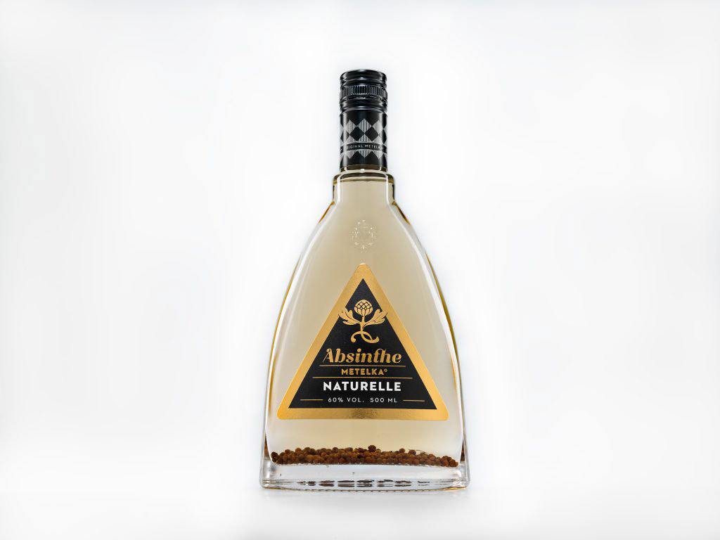 Absinthe Metelka Naturelle - Absinthe Naturelle is a premium product of Metelka. It’s given a special care. This Absinthe is made by a special technology. As the name implies, it’s completely natural product without a use of any artificial colors. On the bottom of every bottle, there are purified coriander seeds that emphasize its natural character. Coriander seeds are macerated for a few months prior adding to the final product, so they do not change the flavor of Absinthe Naturelle.