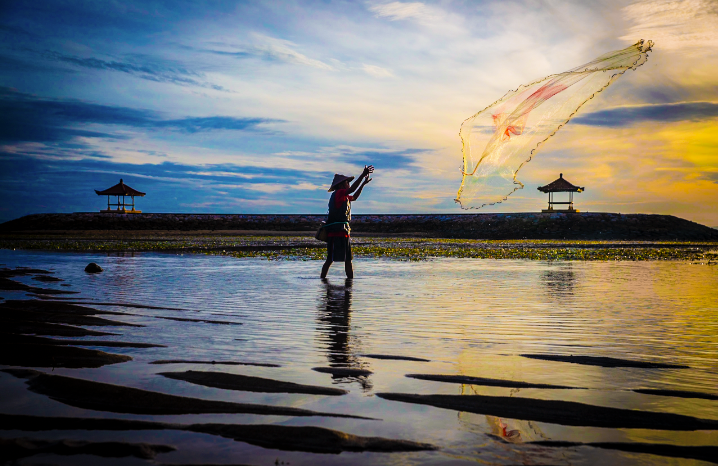 Indonesian villager fishing at Dawn