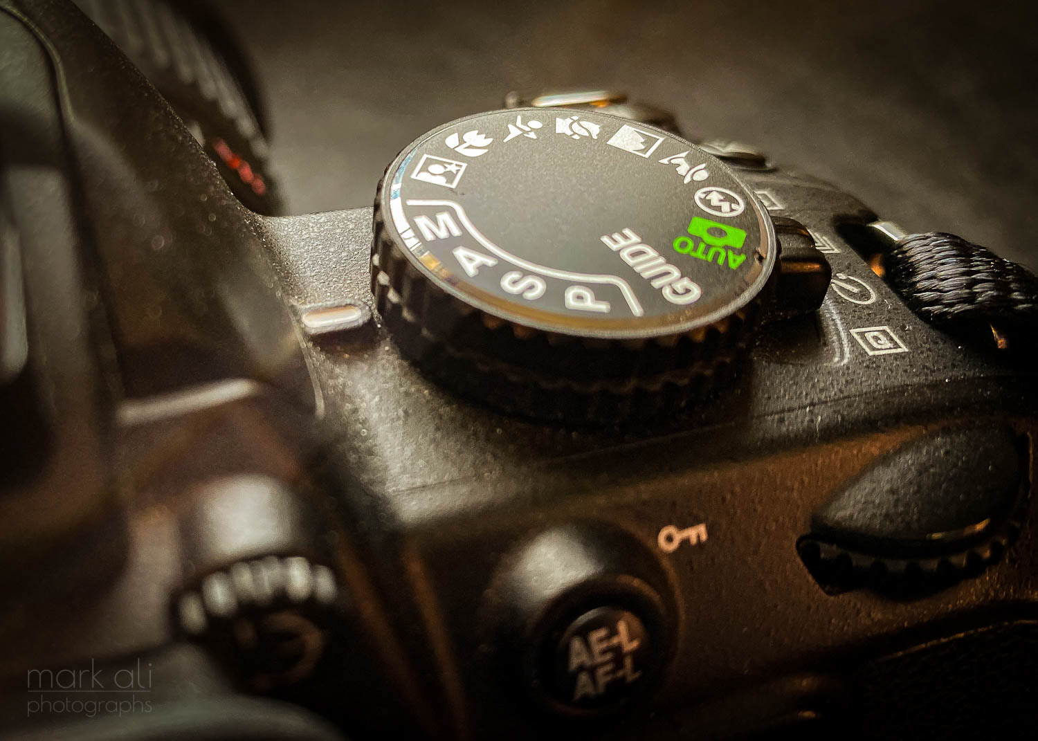 Close-up of the mode dial on a camera