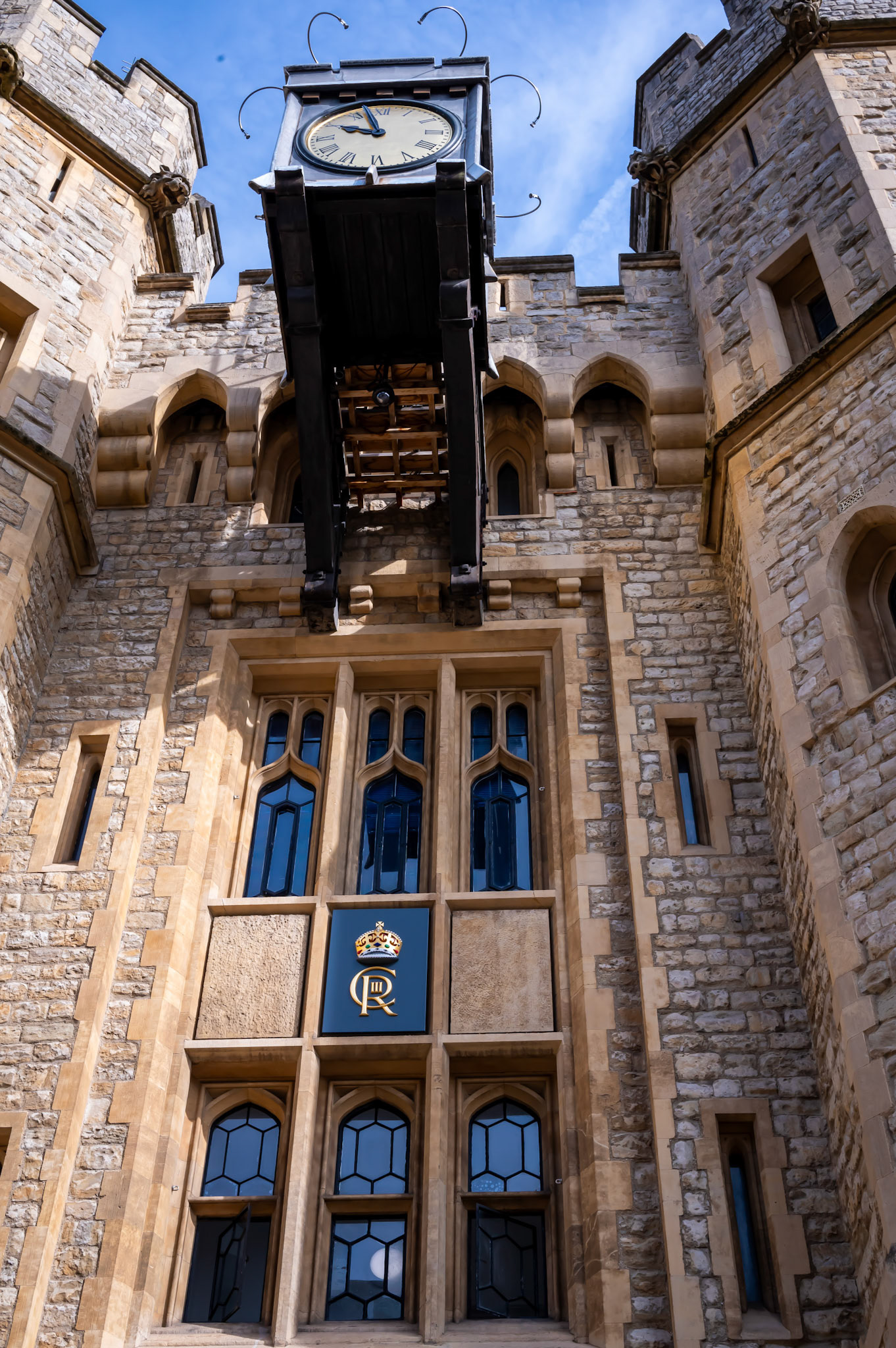 Entrance to the building containing the crown jewels, inside the Tower of London, displaying the recently installed monogram of King Charles III.