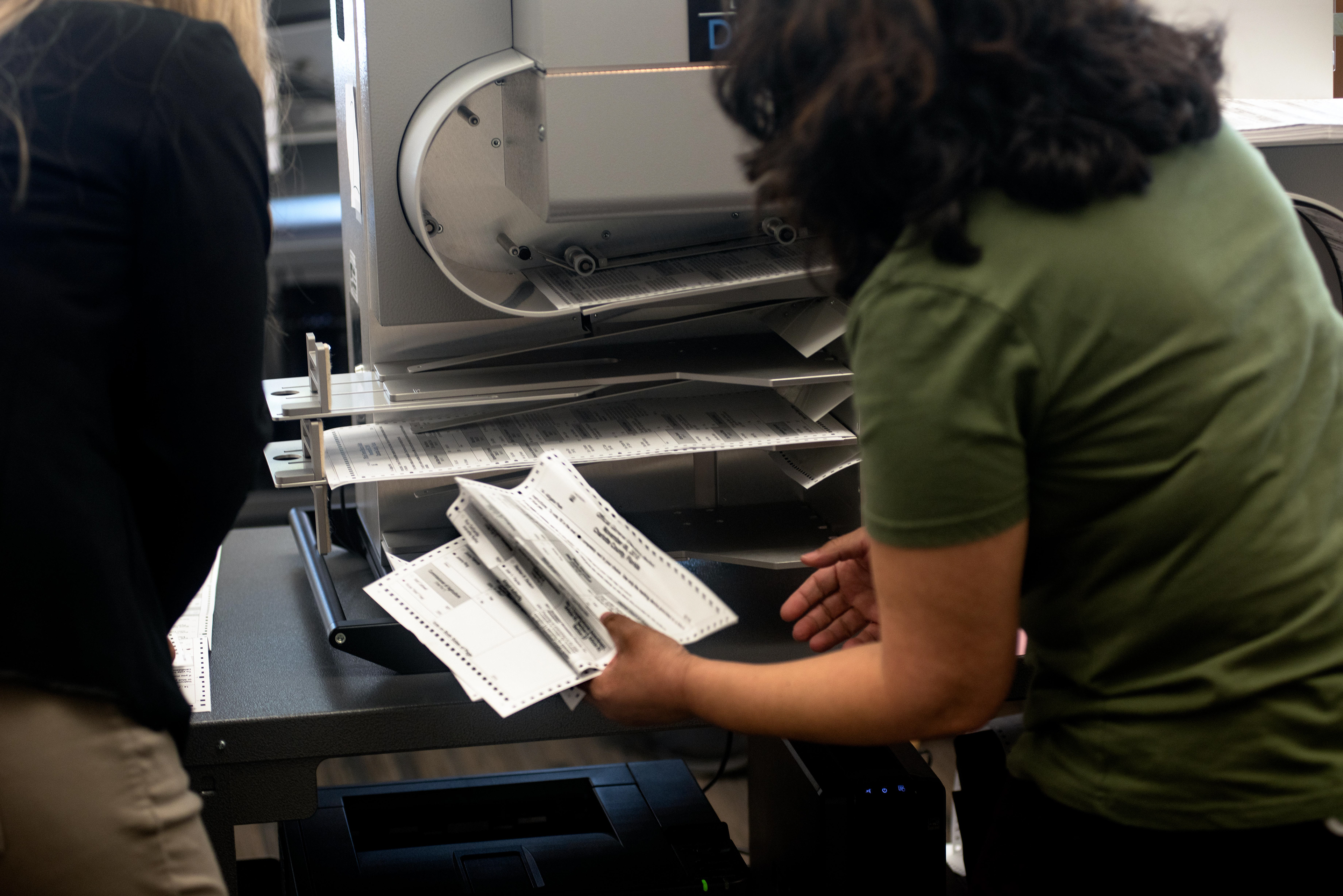 A paper jam occurs, at the Charlotte County Courthouse, during the Florida statewide re-count, at the Charlotte County Courthouse, on Monday, Nov. 12, 2018, in Punta Gorda, Fla.