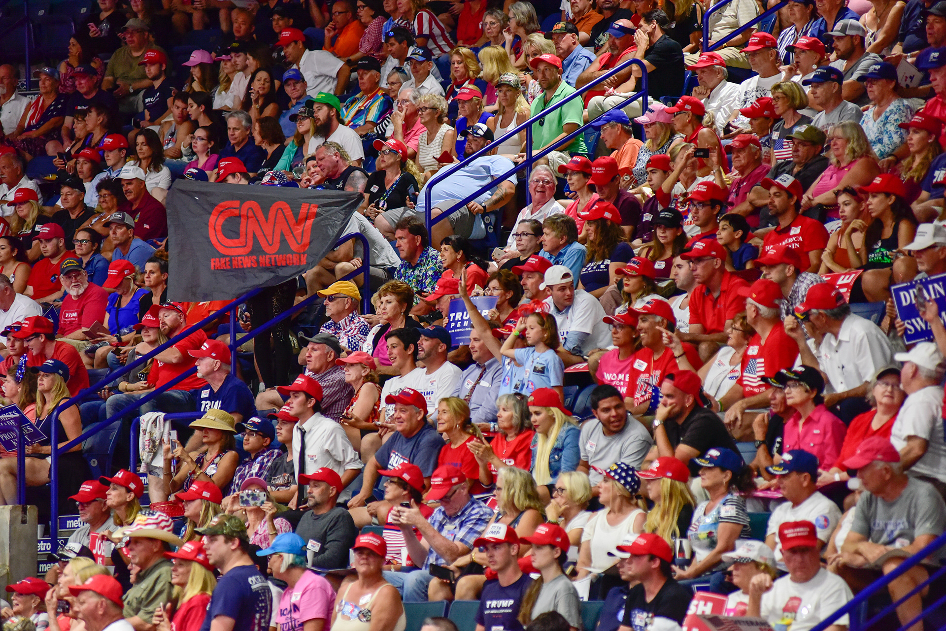 A large crowd shouts "CNN sucks" at a Trump rally, on Wednesday, Oct. 31, 2018, in Estero, Fla.