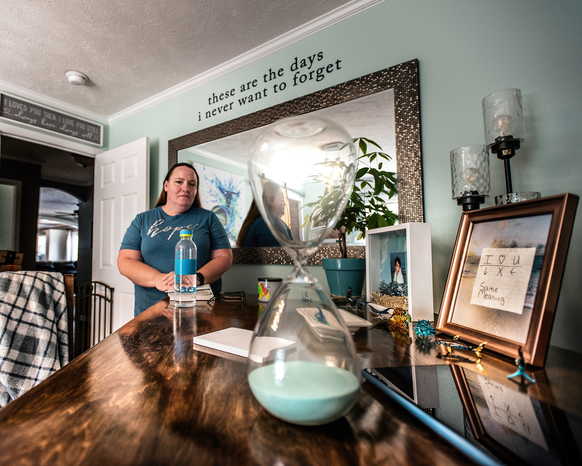 A mother stands in the room where her son died by suicide ten months earlier