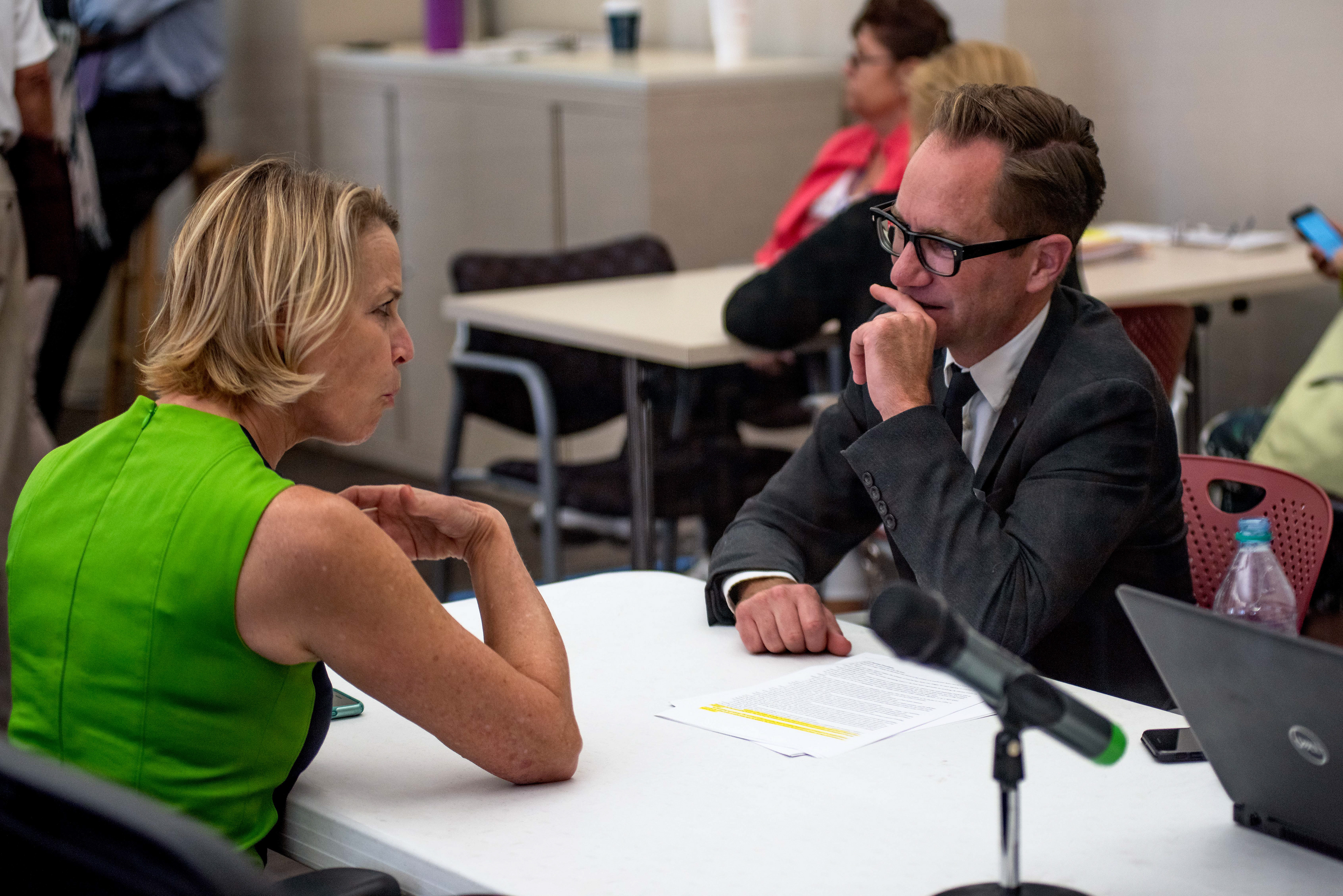 Jennifer Scuteri, volunteer attorney for Bill Nelson, speaks with Peder Thoreen, San Francisco based volunteer attorney for Andrew Gillum, during the Florida statewide re-count, at the Charlotte County Courthouse, on Monday, Nov. 12, 2018, in Punta Gorda, Fla.