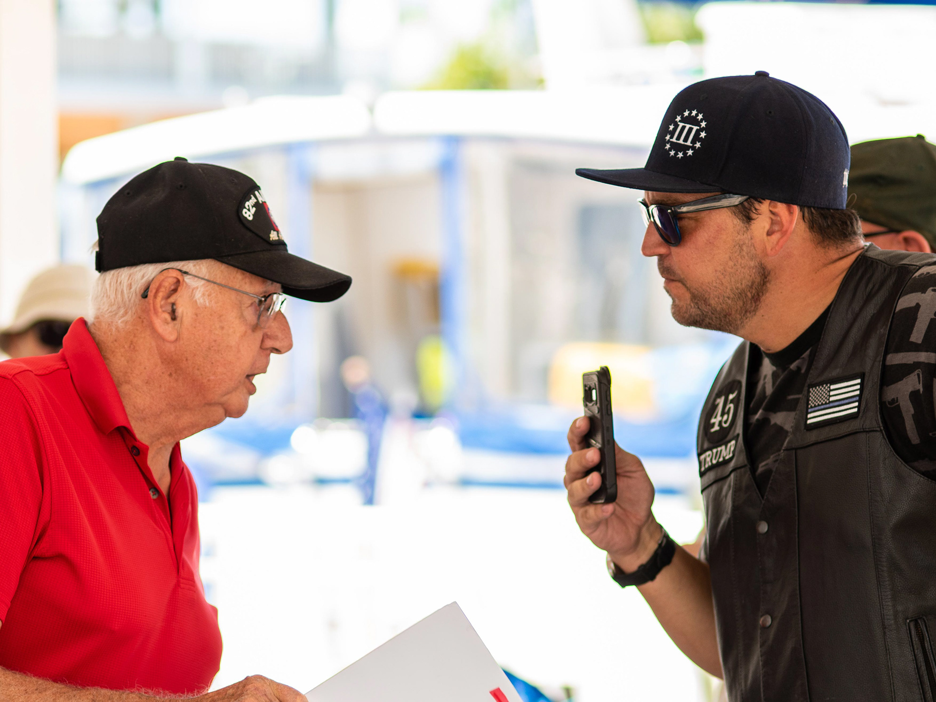 Air Force Veteran David Lagg (left) confronts Gun Rights Protester Gary Snow, saying “I’ve been under fire, and so have these kids. I can’t imagine how you can stand under the (American) flag”, at the March For Our Lives voter registration event, in Punta Gorda, Tuesday.