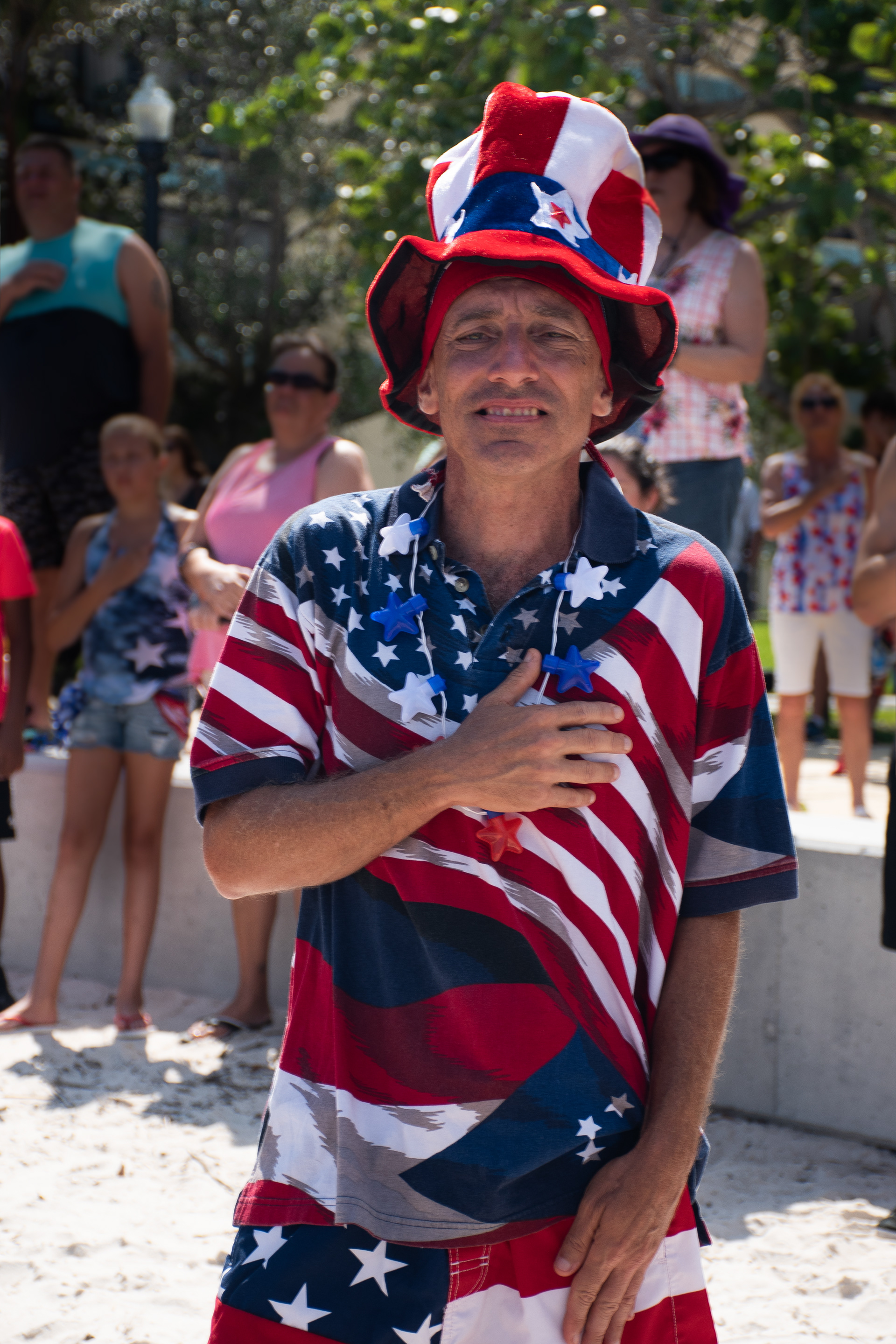 A man recites the Pledge of Allegiance, at the "Freedom Swim, on July 4. 2018, in Punta Gorda.