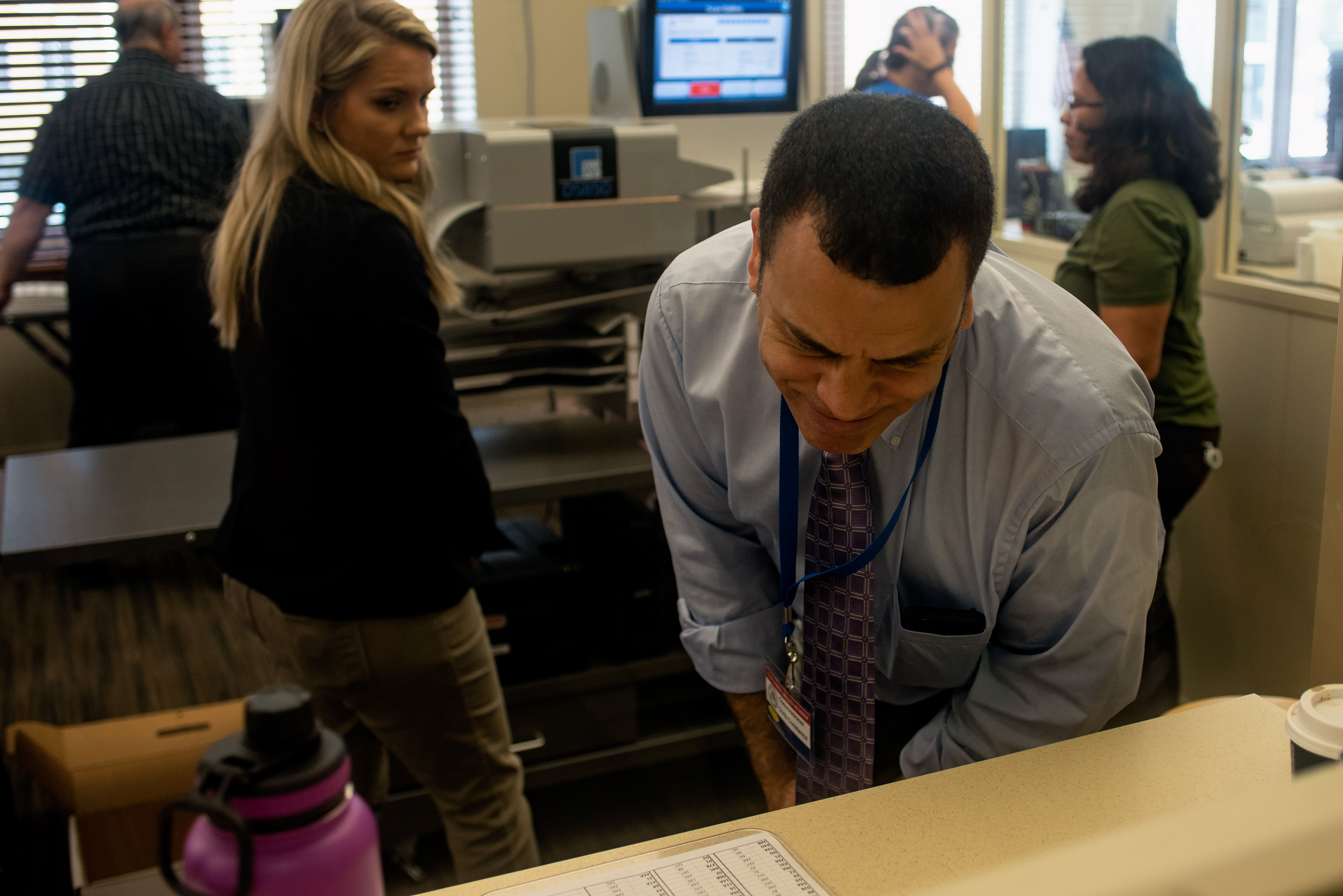 Charlotte County Commissioner Chris Constance reviews re-count statistics, while an election employee observes, at the Charlotte County Courthouse, on Monday, Nov. 12, 2018, in Punta Gorda, Fla.