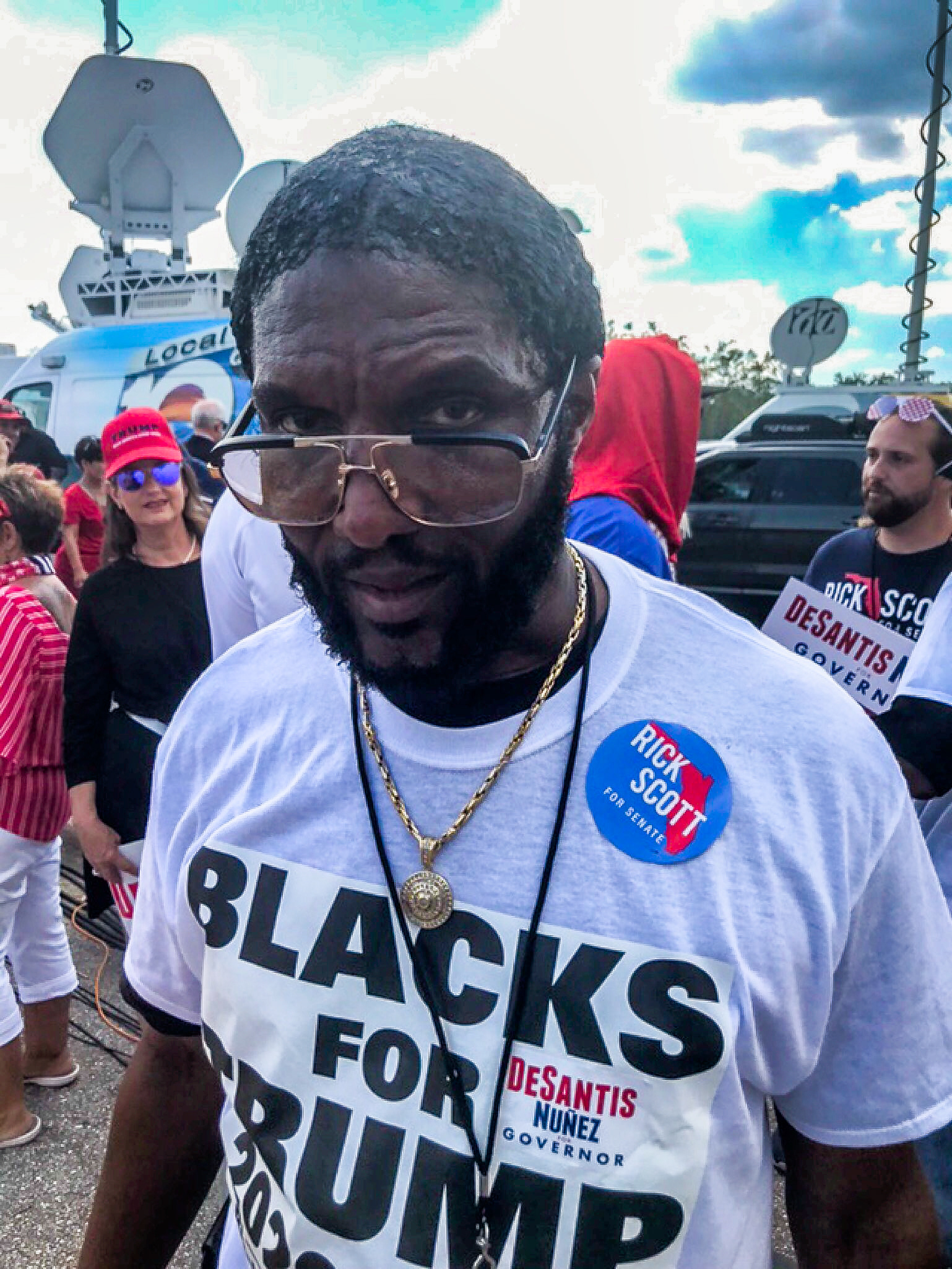 “Blacks For Trump” President Michael Symonette, waits outdoors, before a Trump rally, on Wednesday, Oct 31, 2018, in Estero, Fla.