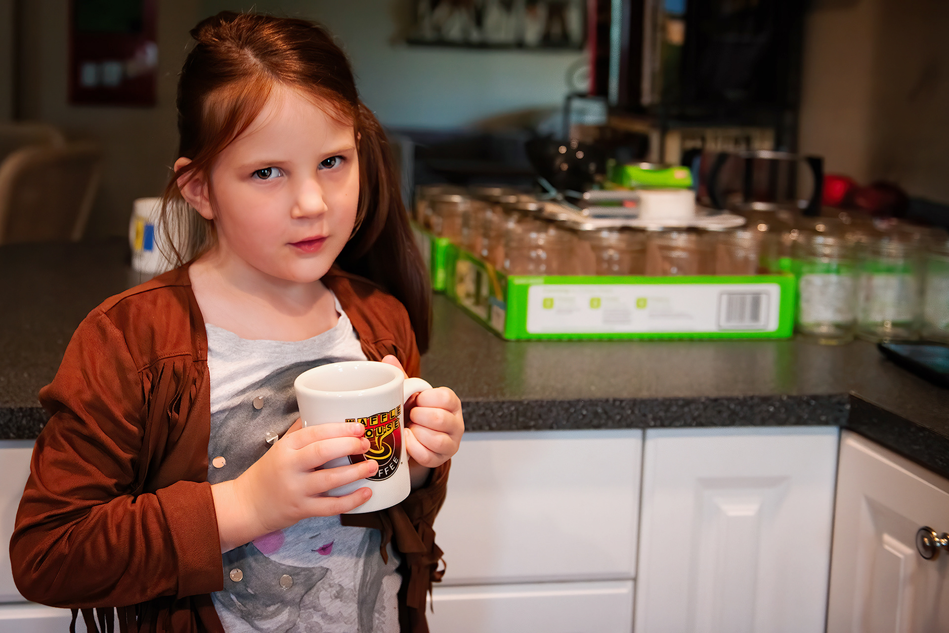 My daughter listens to Stan Rogers with me, in front of canned chicken stock.