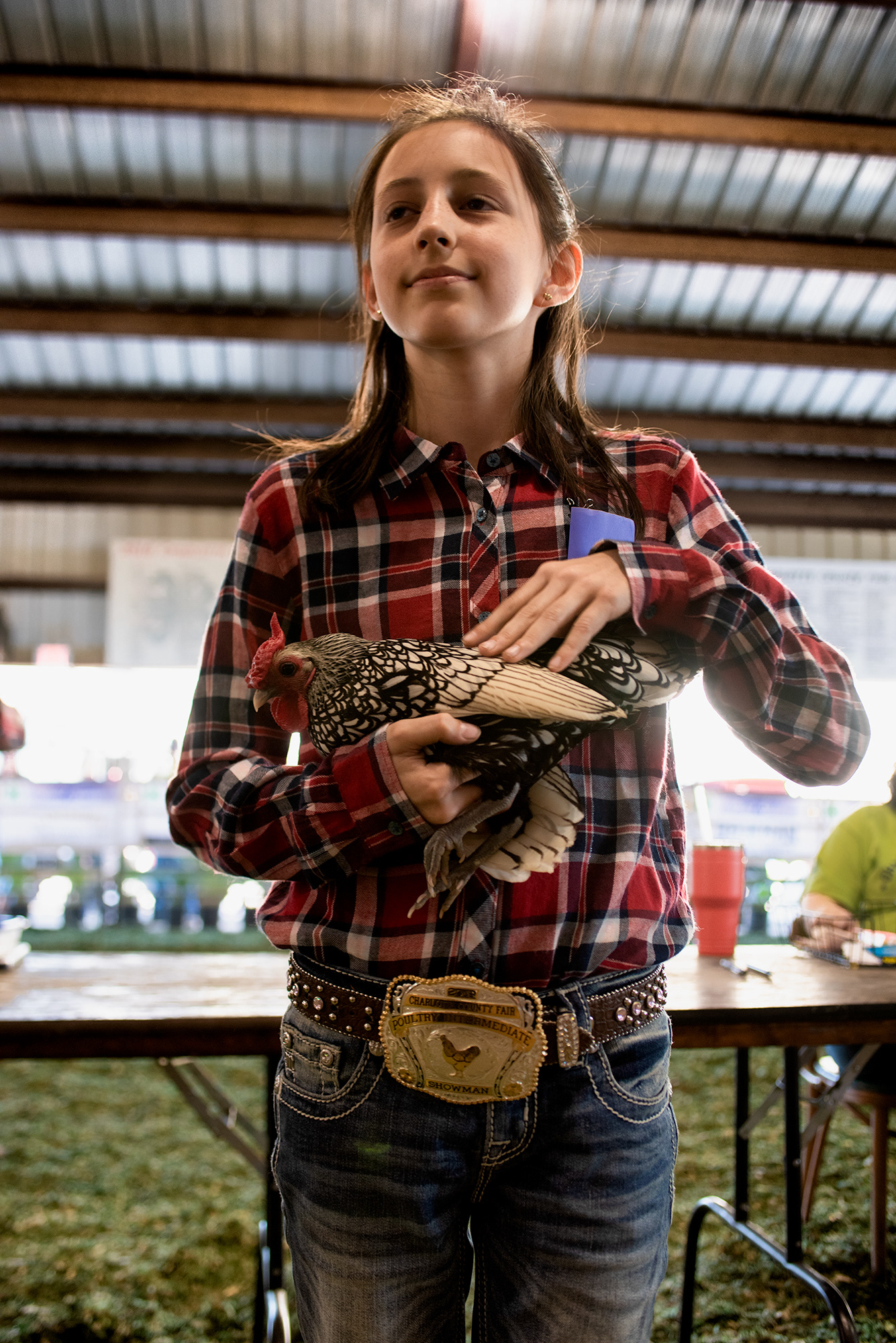 Children spend final moments with the animals they had raised, before auction.