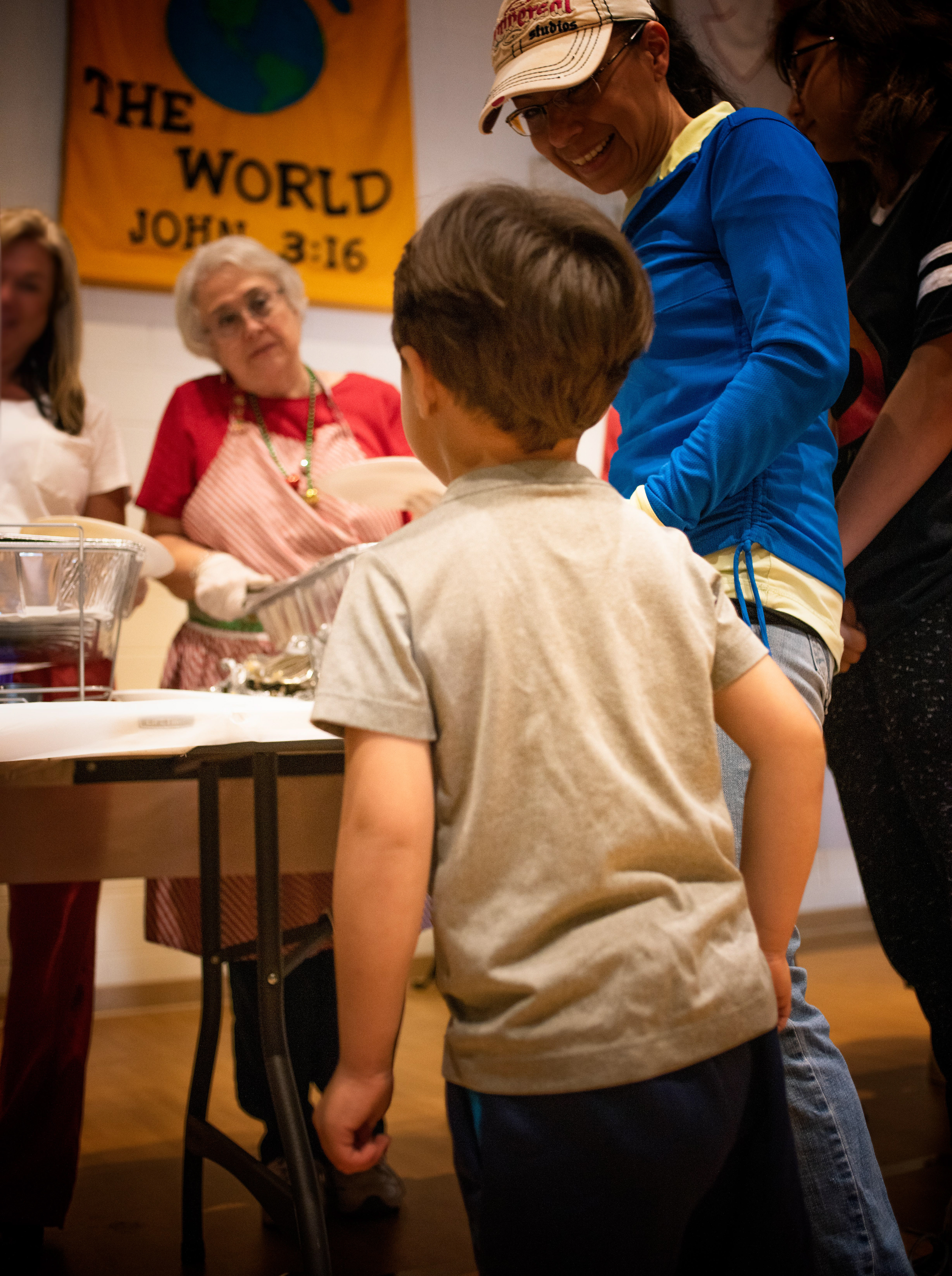 A Foster-child waits in line for Christmas Dinner.