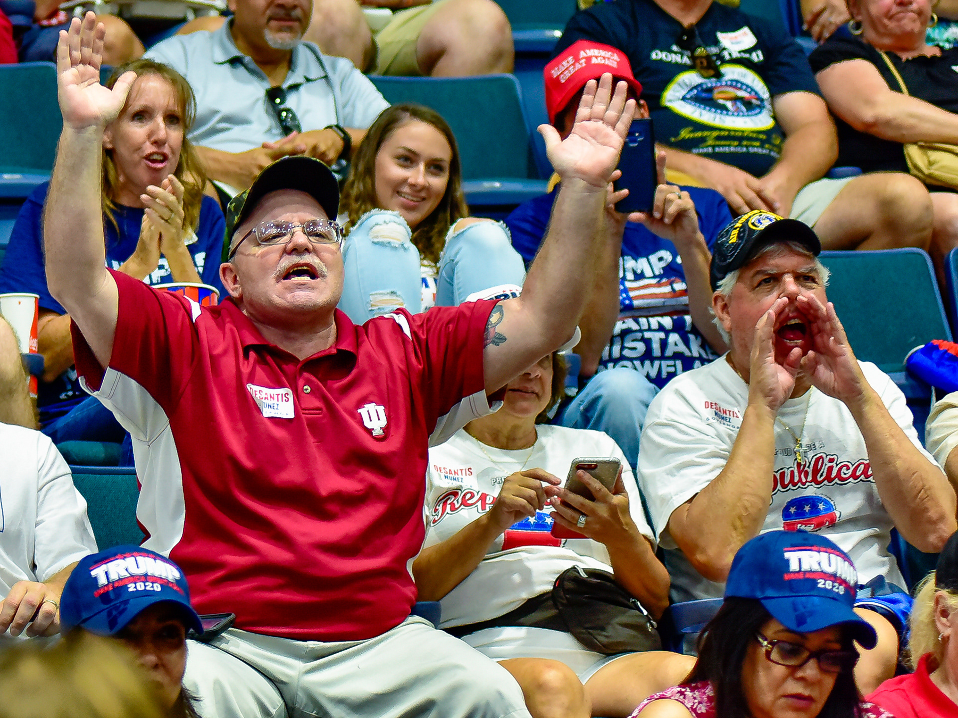 A man shouts "fake news" at a Trump rally on Wednesday, Oct. 31, 2018, in Estero, Fla