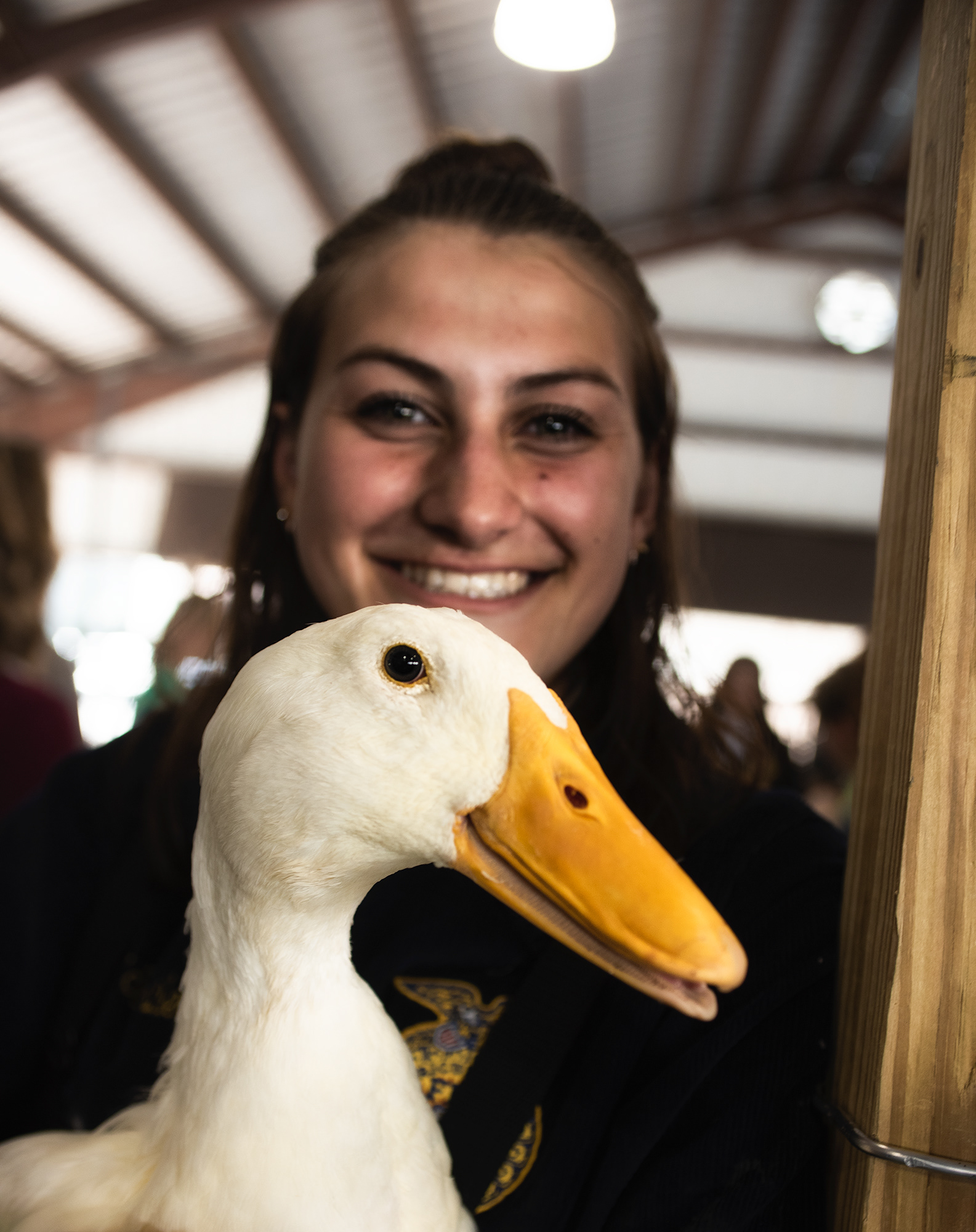 Children spend final moments with the animals they had raised, before auction.