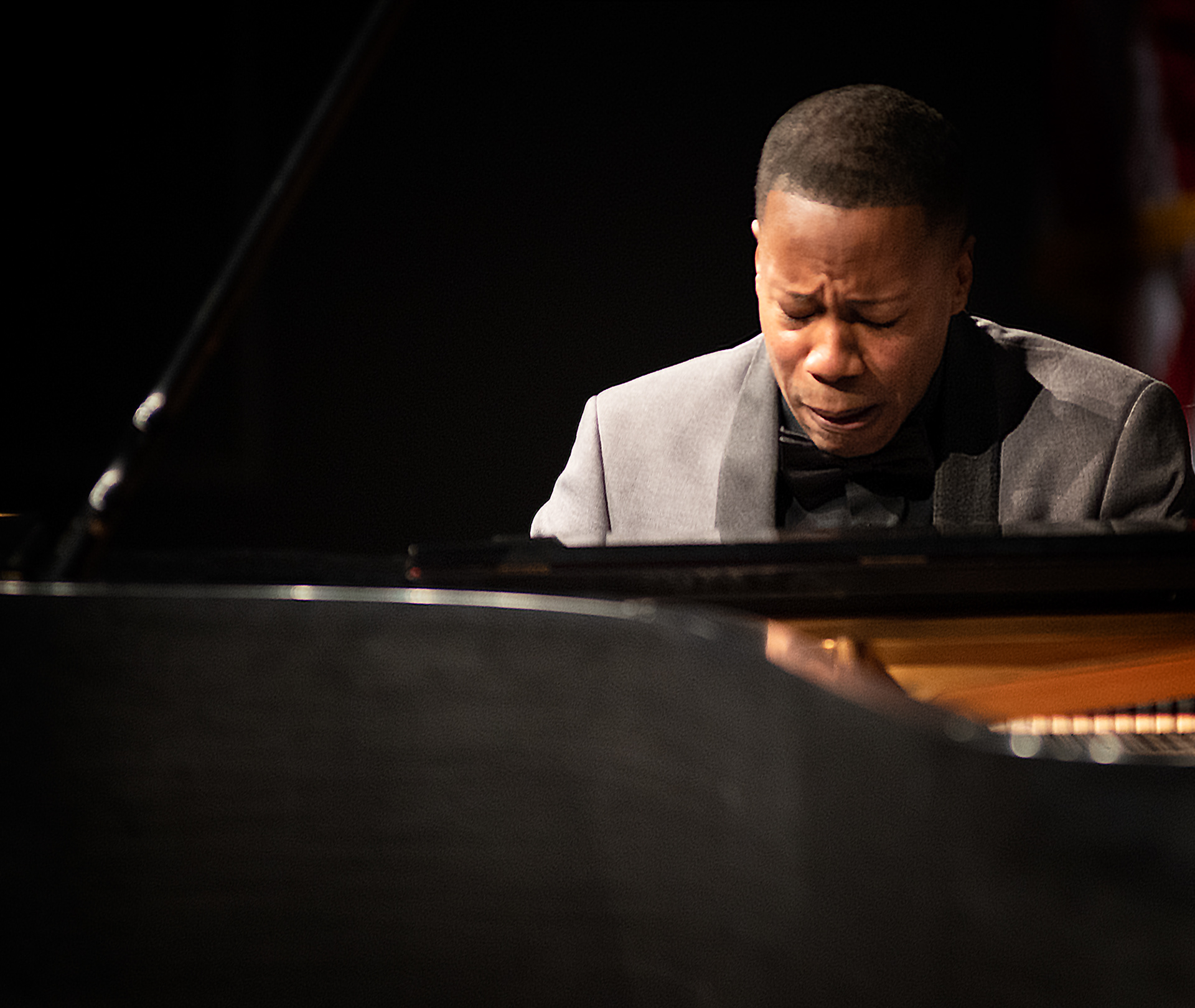 Guest Artist Terrence Wilson speaks to the piano, as he performs with the Charlotte Symphony Orchestra.