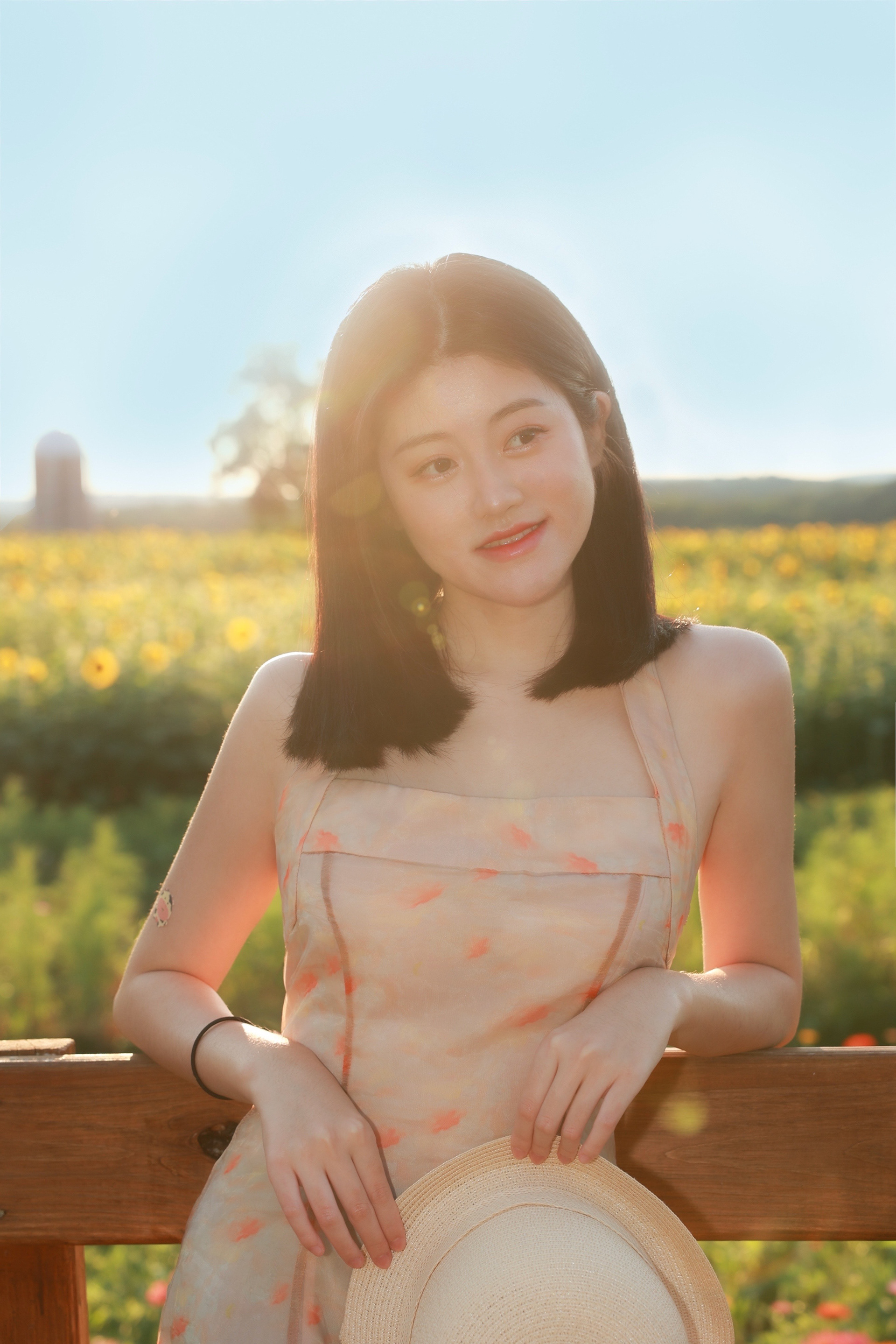 Nijia smiling at the sunflower field