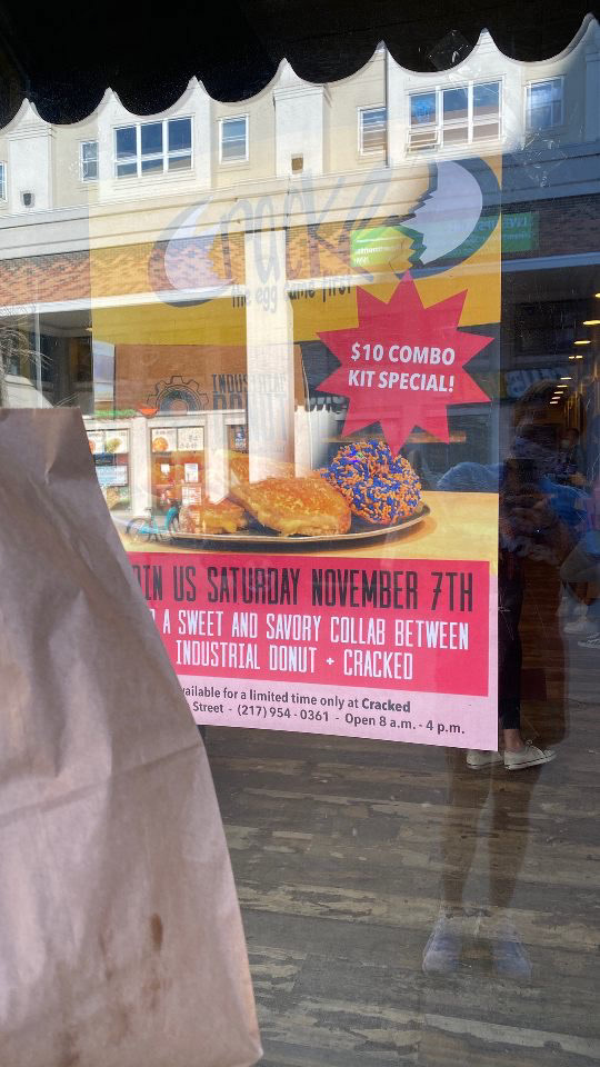 Our Sweet and Savory Collab Flyer in the Store Window at Cracked