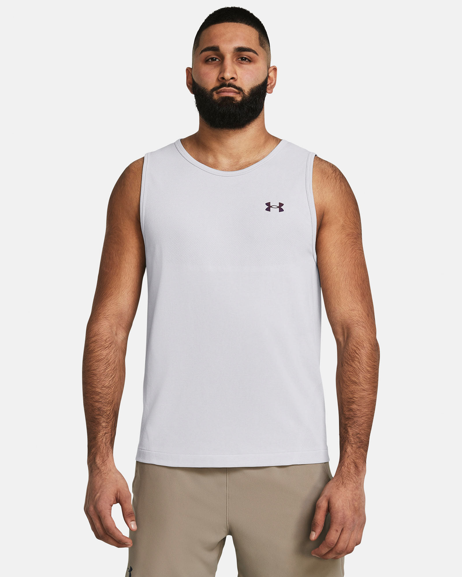 Muhammad Abbasi | Under Armour | Ecom Shoot | White sleeveless training tank with beige shorts