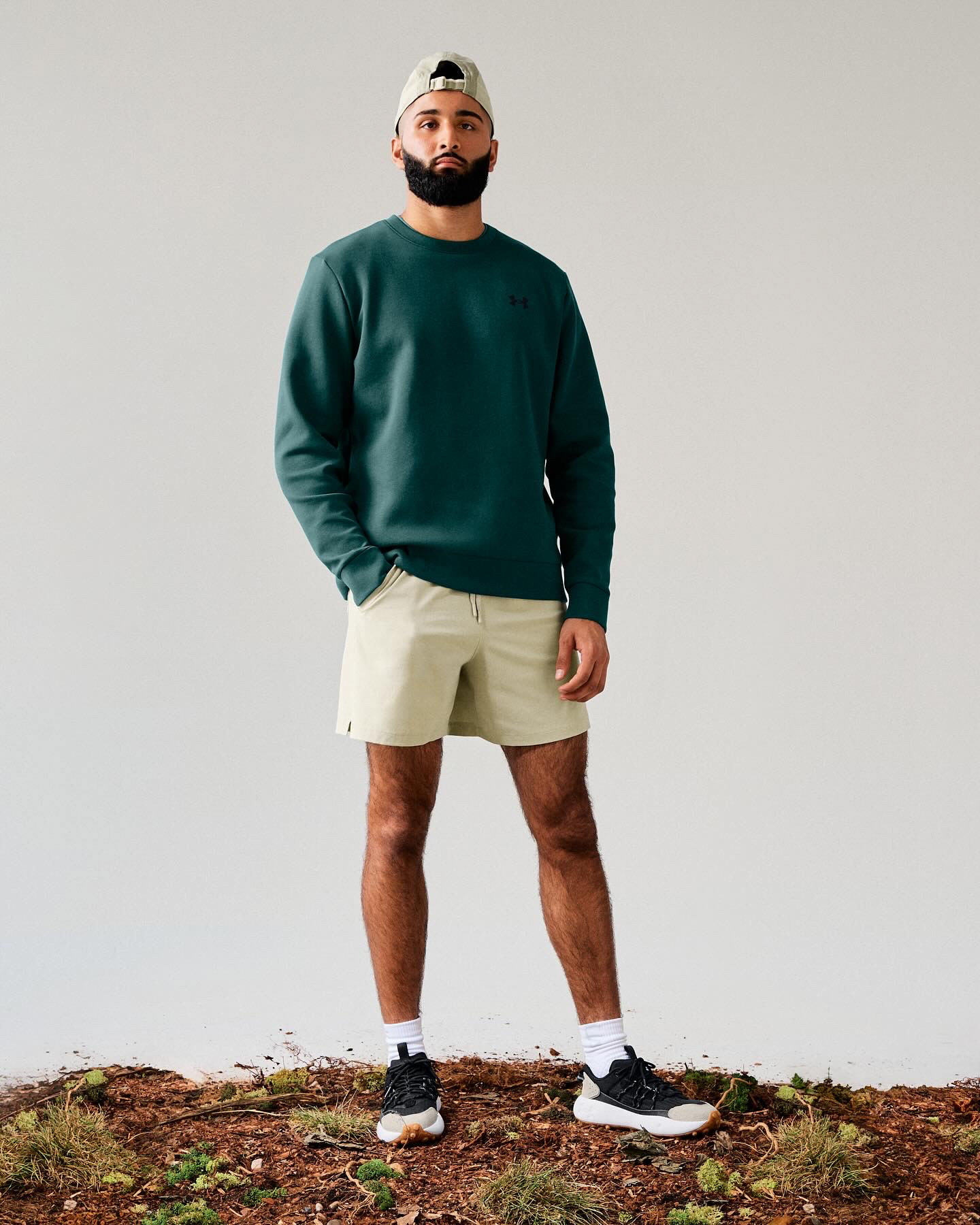 Muhammad Abbasi | Under Armour | Fat Tire Venture Pro | Standing in green crewneck and tan shorts facing forward