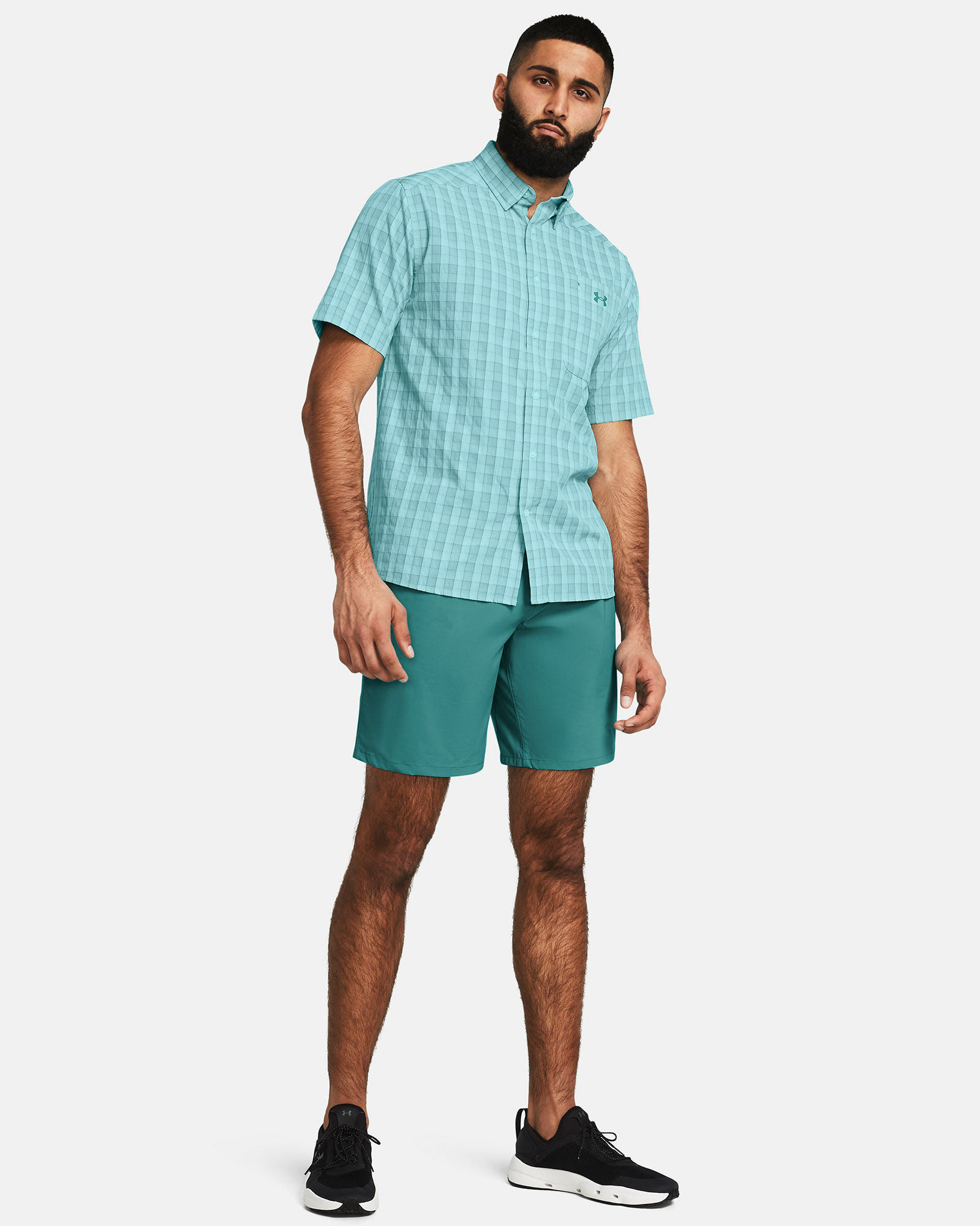 Muhammad Abbasi | Under Armour | Ecom Shoot | Light teal checkered short-sleeve button-up shirt with teal shorts